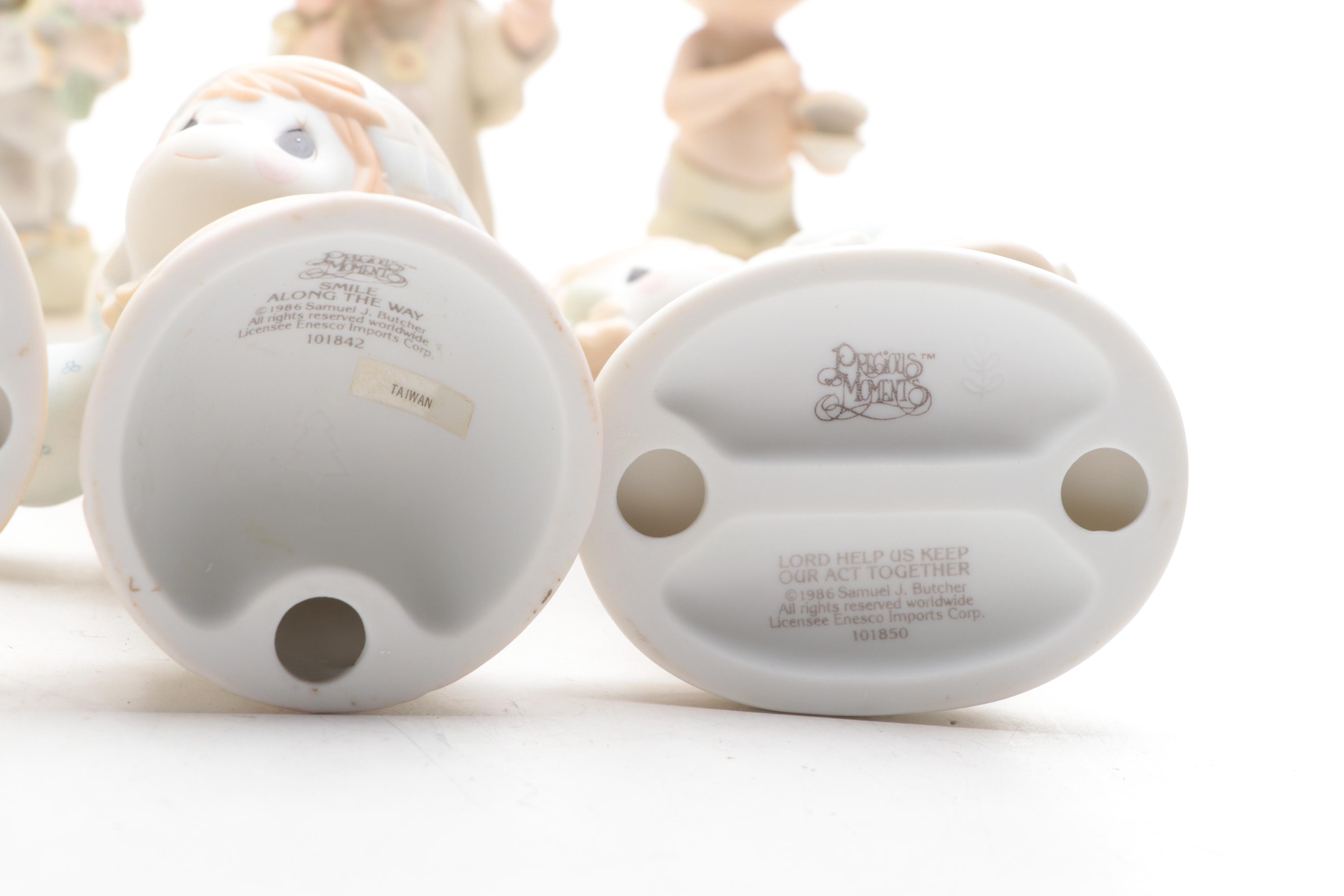 Precious Moments Porcelain Figurines Including "Put on a Happy Face" and More
