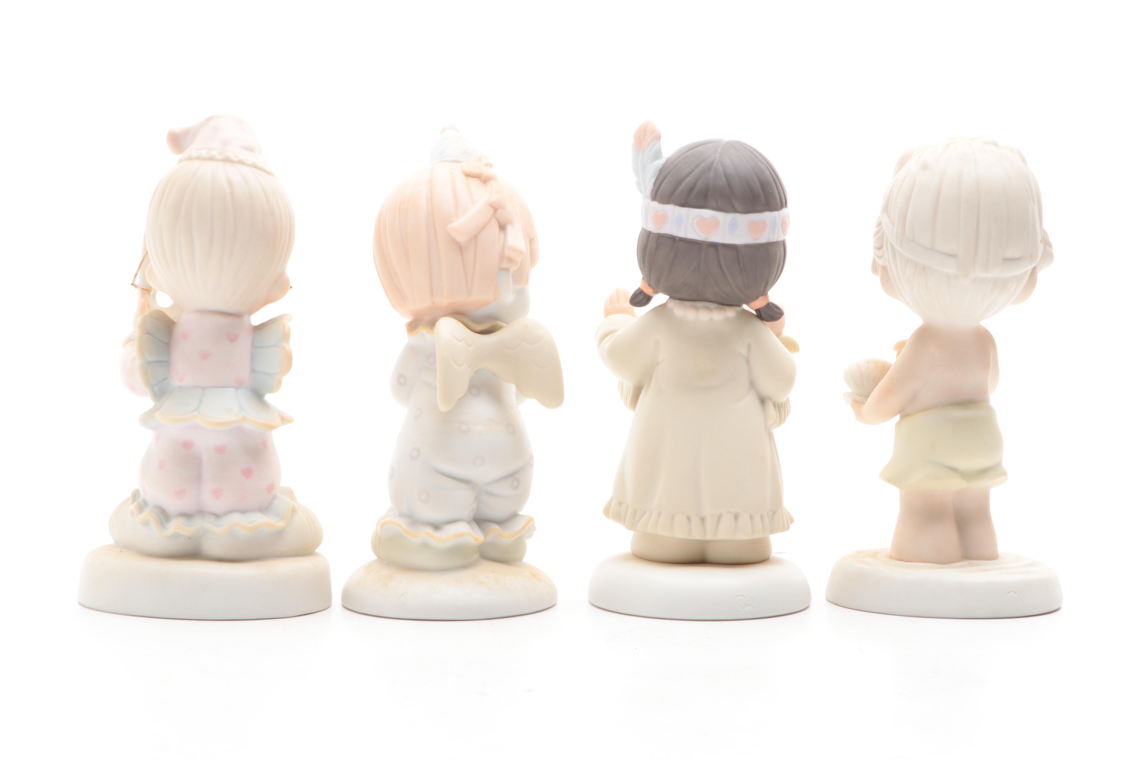 Precious Moments Porcelain Figurines Including "Put on a Happy Face" and More