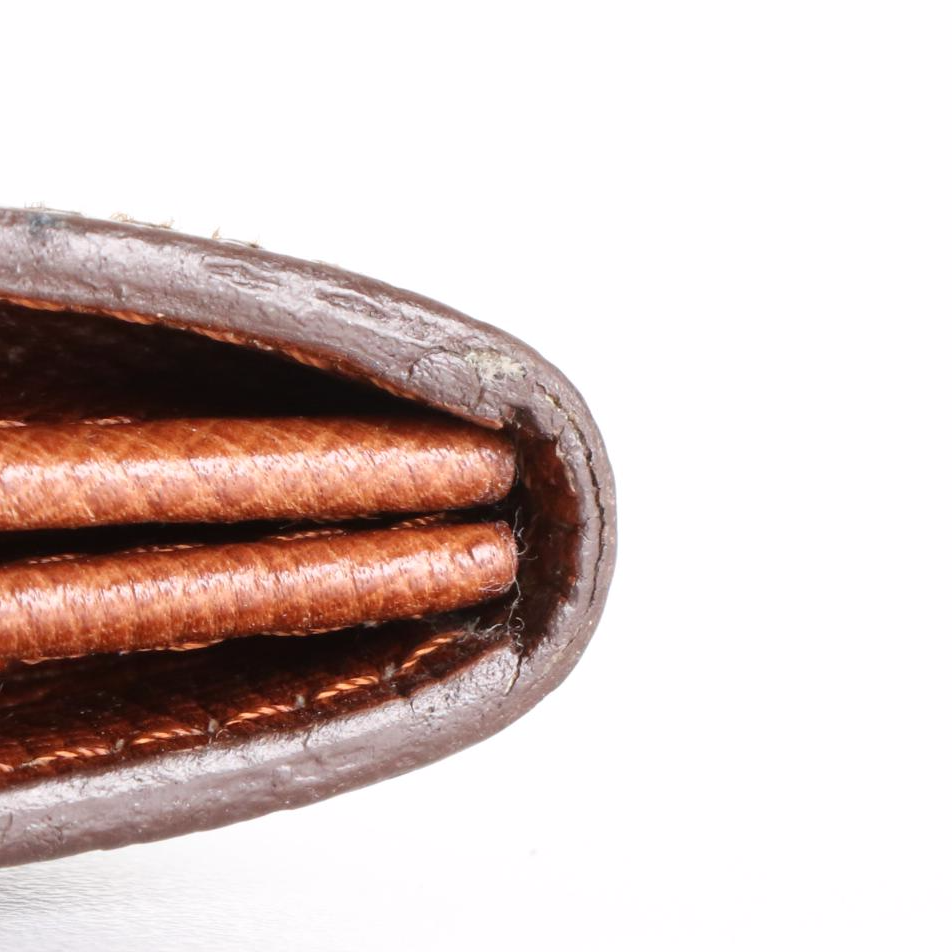 Louis Vuitton Sarah Wallet in Monogram Canvas and Leather