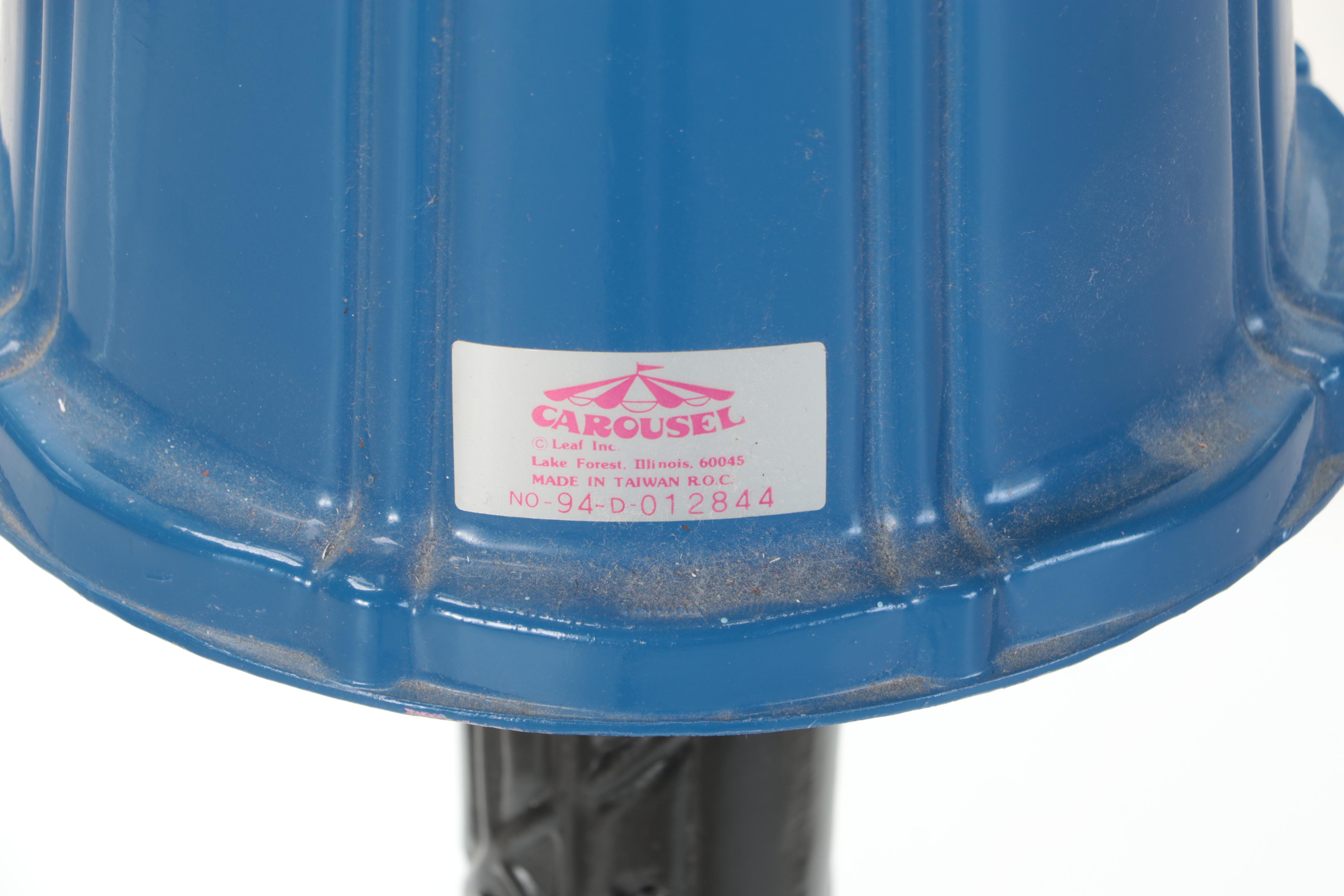 Carousel Coin Operated Candy Dispenser Filled With Marbles