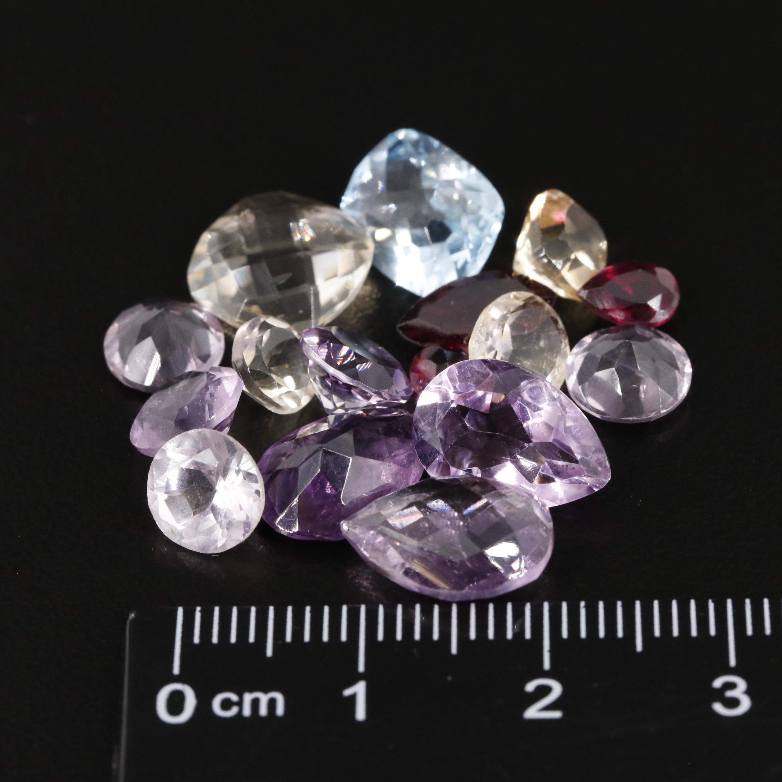 Loose 24.76 CTW Mixed Gemstone Lot Featuring Amethyst Citrine and Garnet