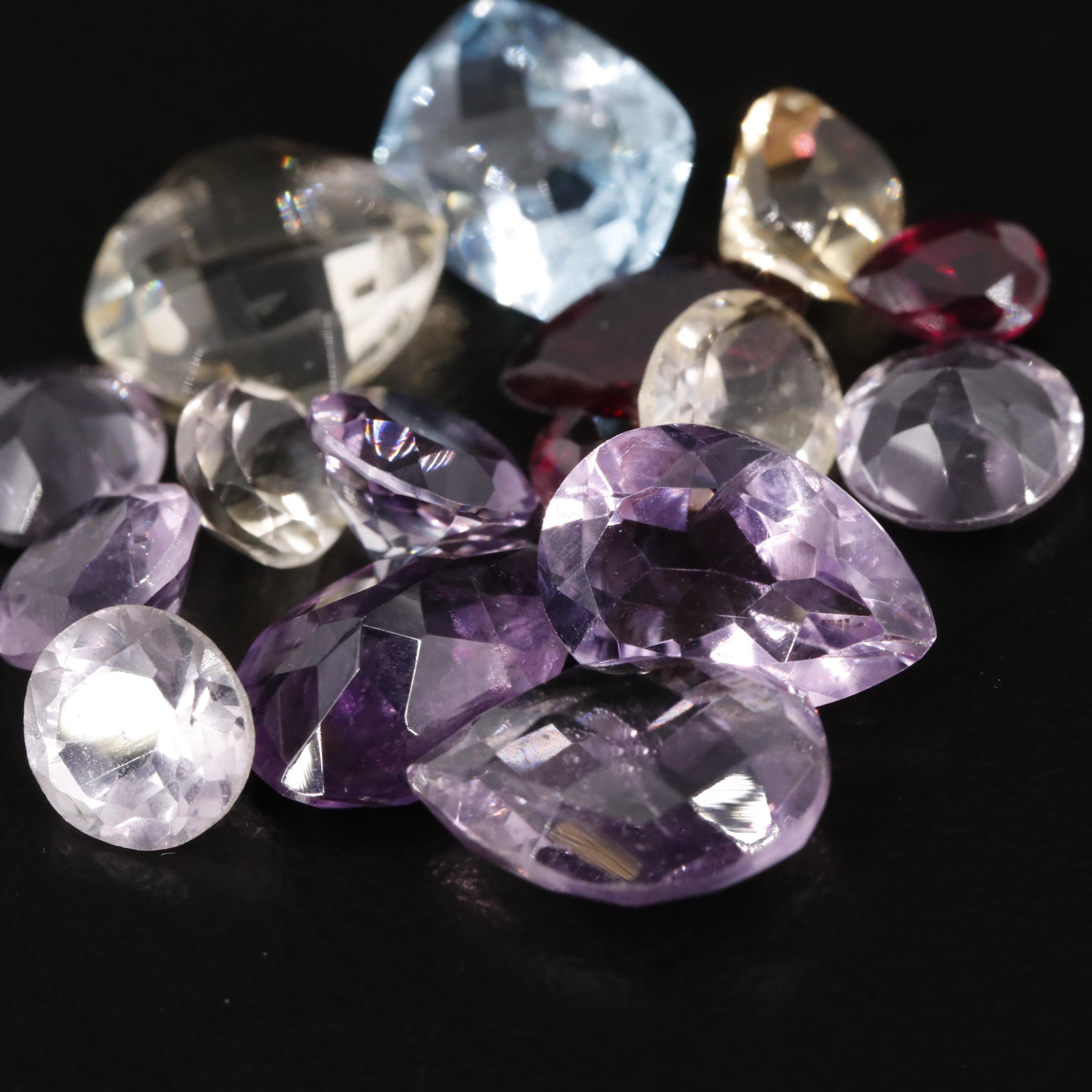 Loose 24.76 CTW Mixed Gemstone Lot Featuring Amethyst Citrine and Garnet
