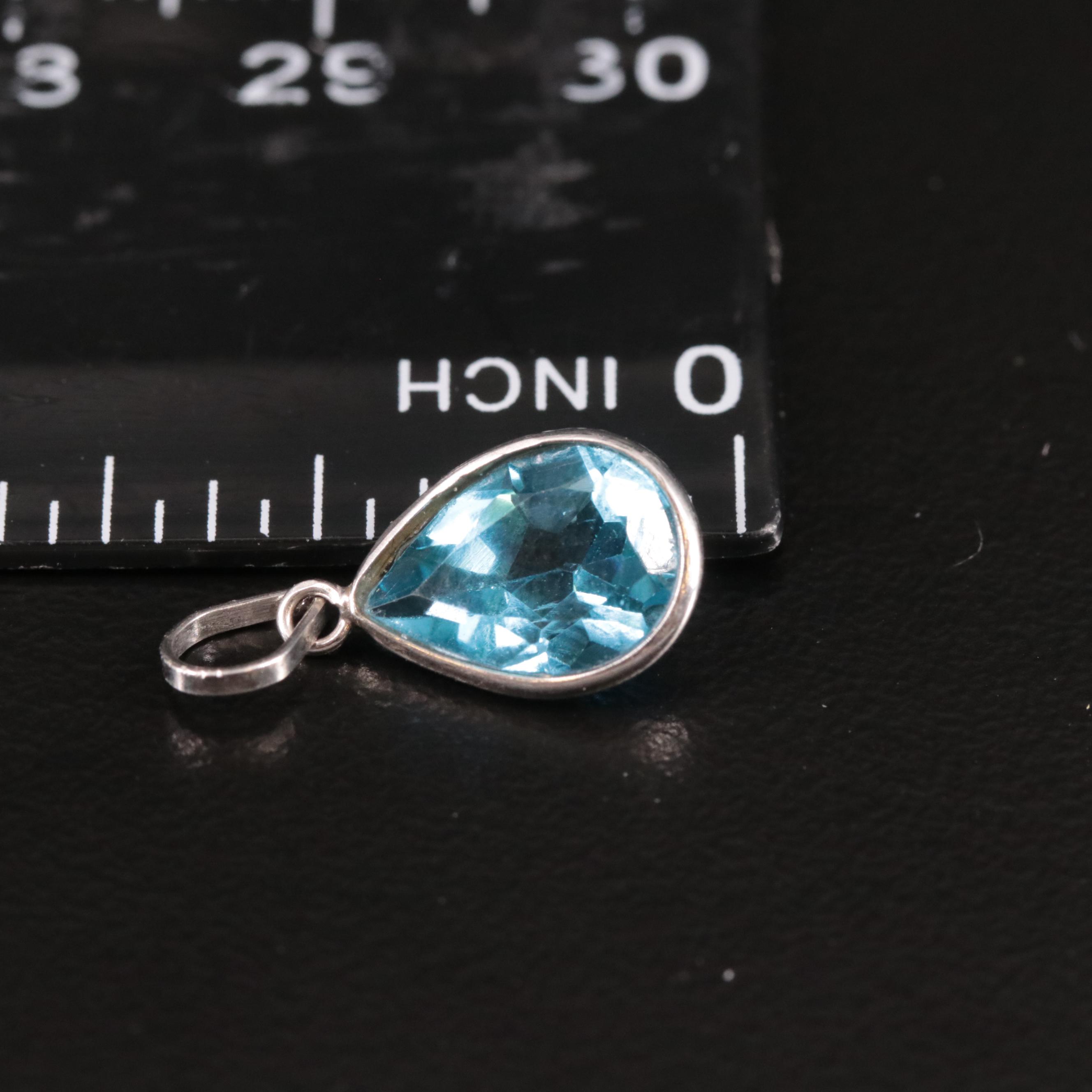 14K Swiss Blue Topaz Pendant