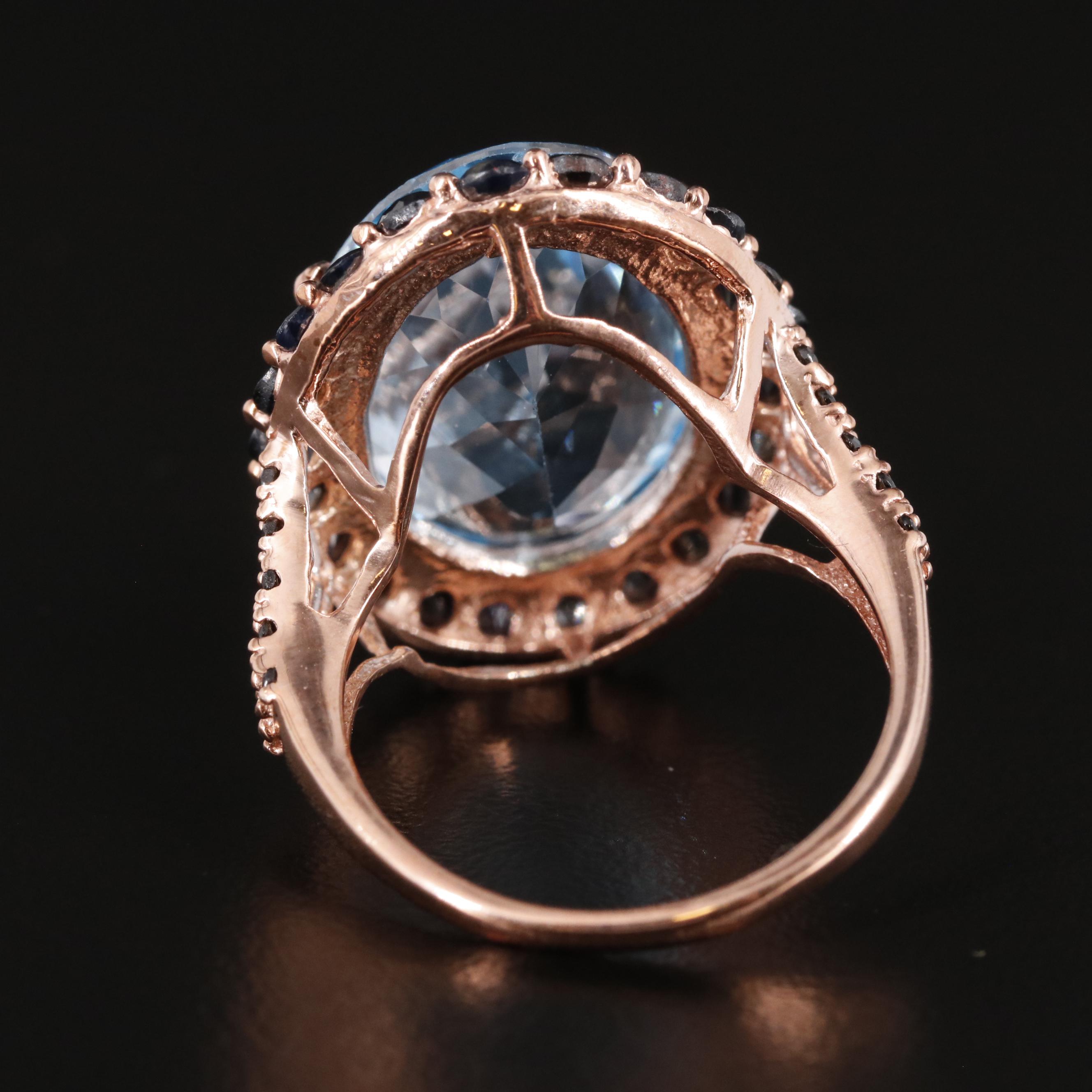 Sterling Blue Topaz and Sapphire Halo Ring
