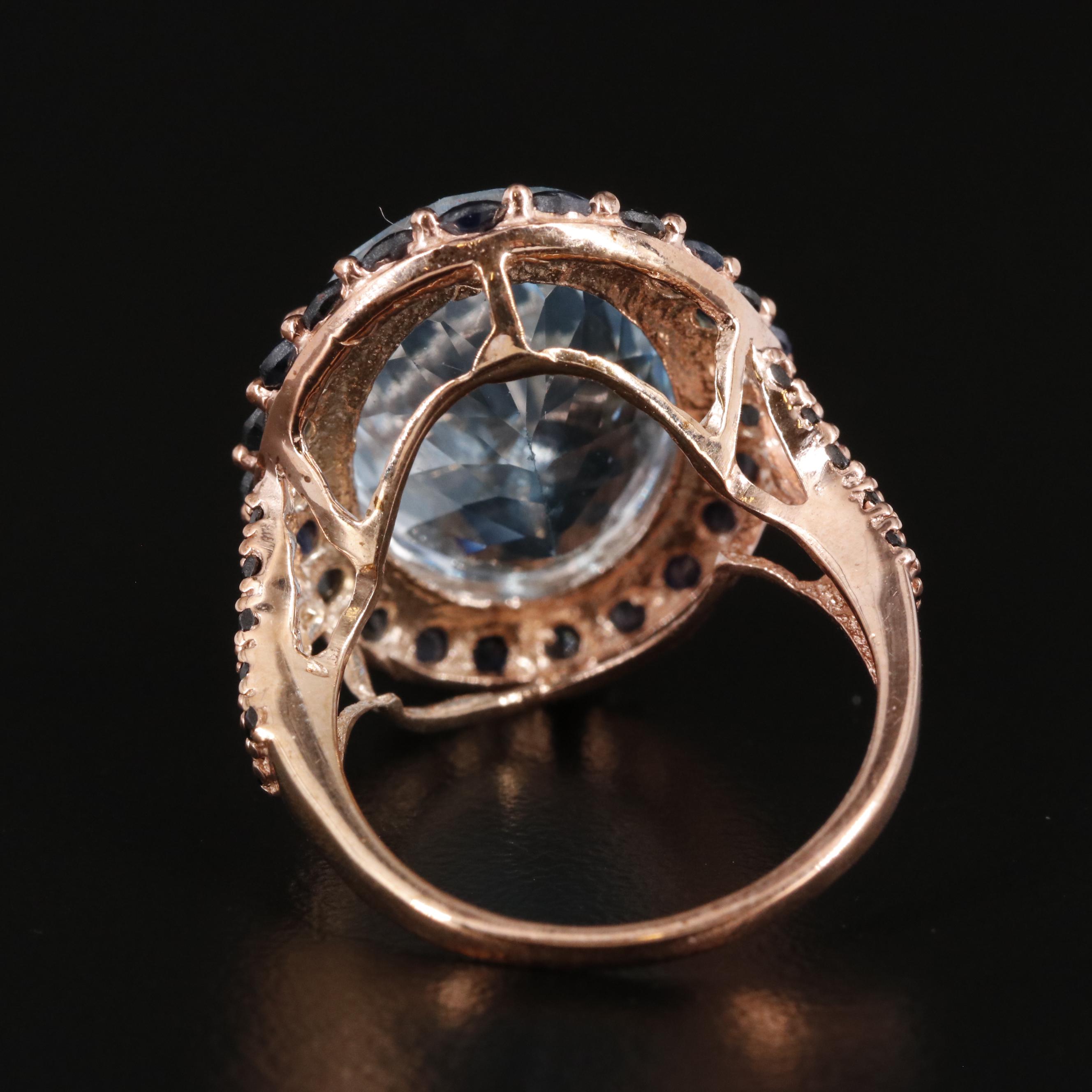 Sterling Blue Topaz and Sapphire Halo Ring