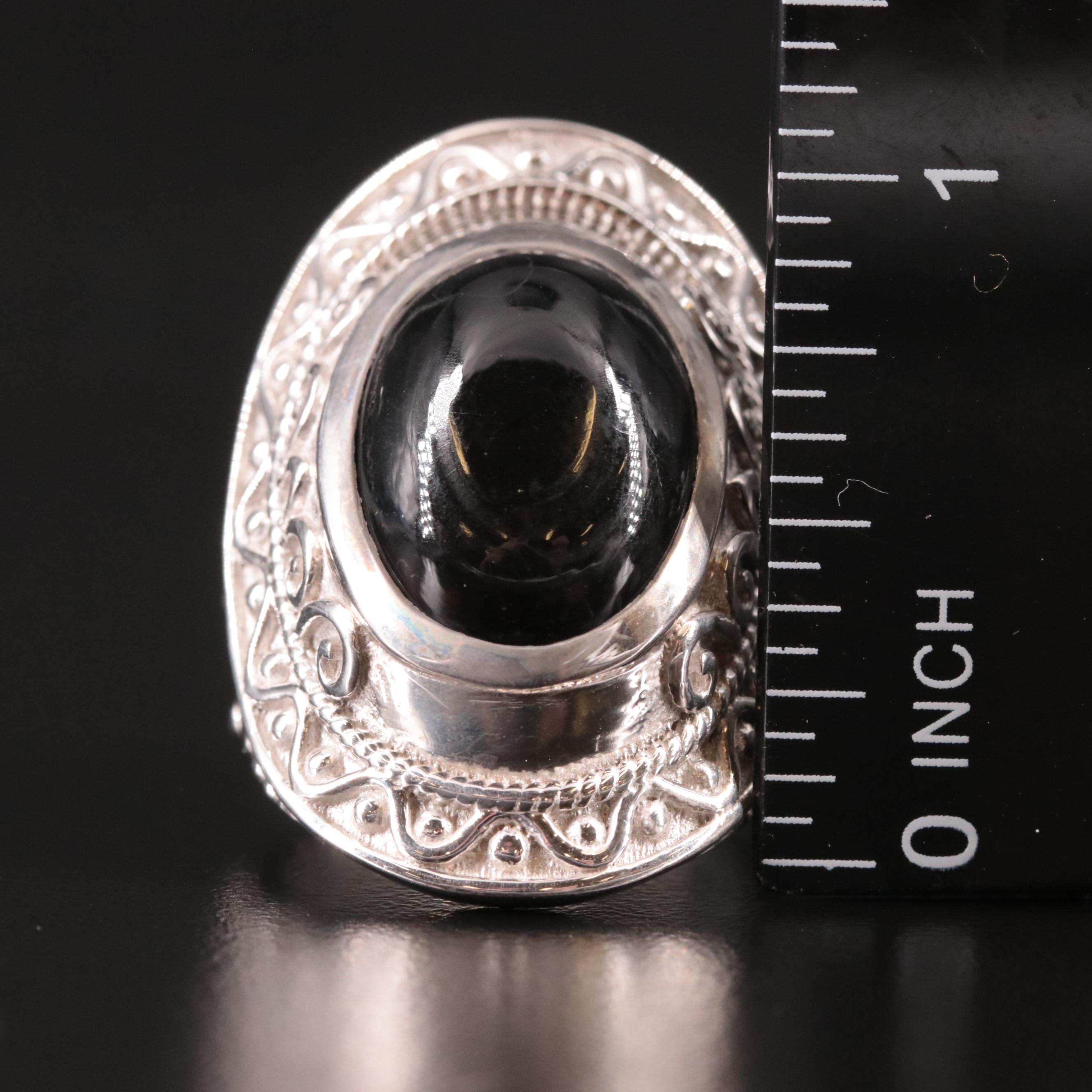 Sterling Black Onyx Saddle Ring with Scrollwork Accents