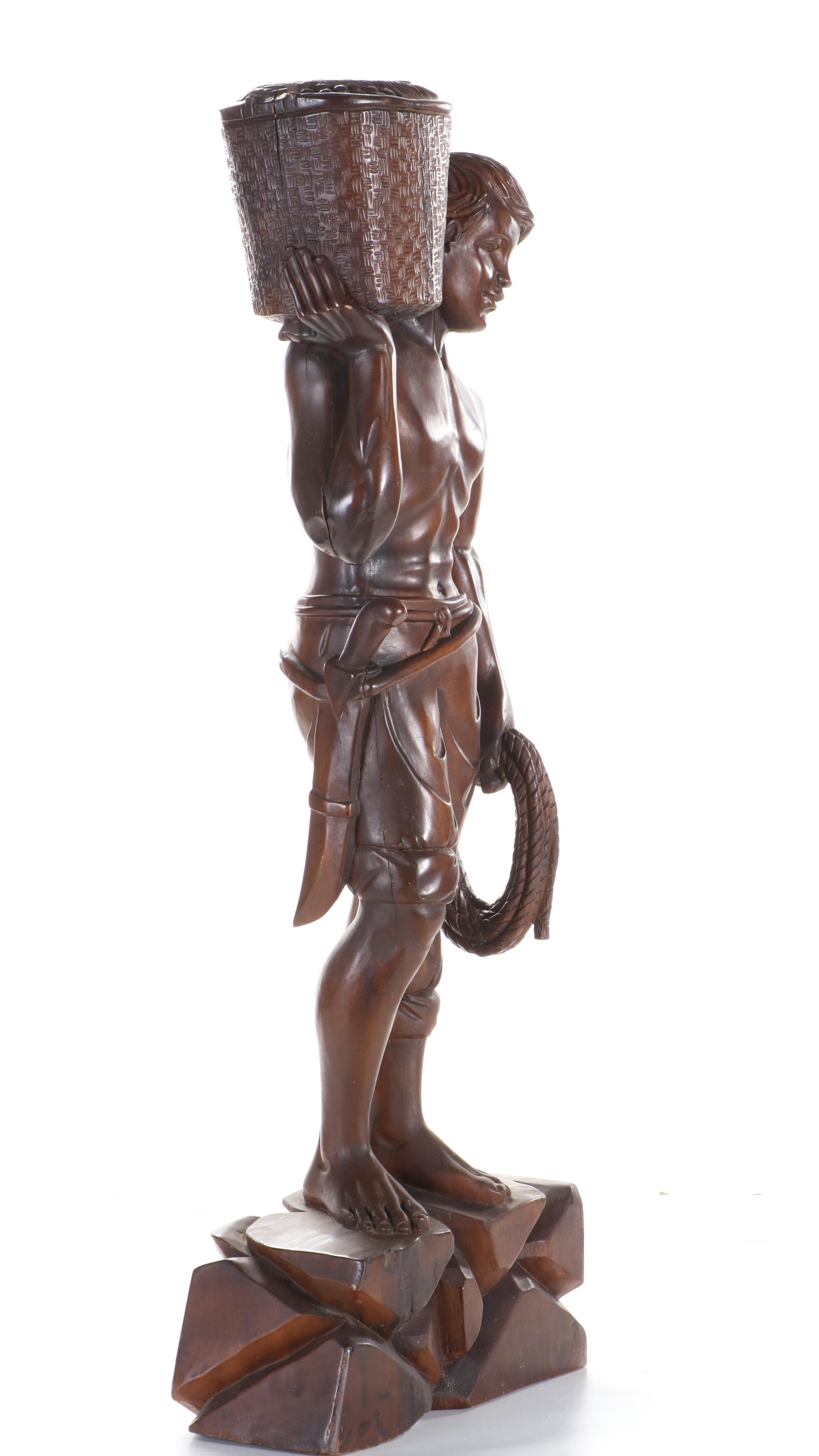 Carved Wood Sculpture of Young Man Carrying Basket, Late 20th Century