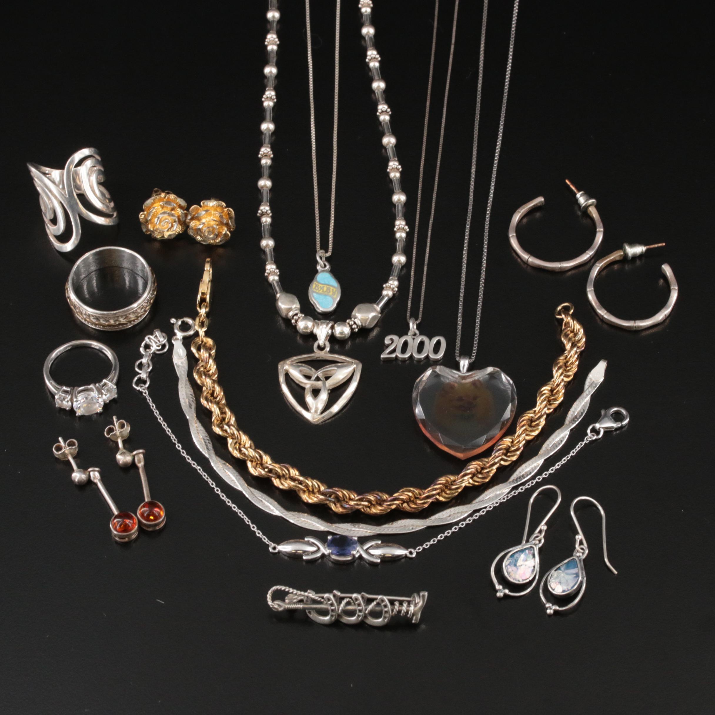 Sterling, Amber and Spinner Ring Featured in Jewelry Assortment