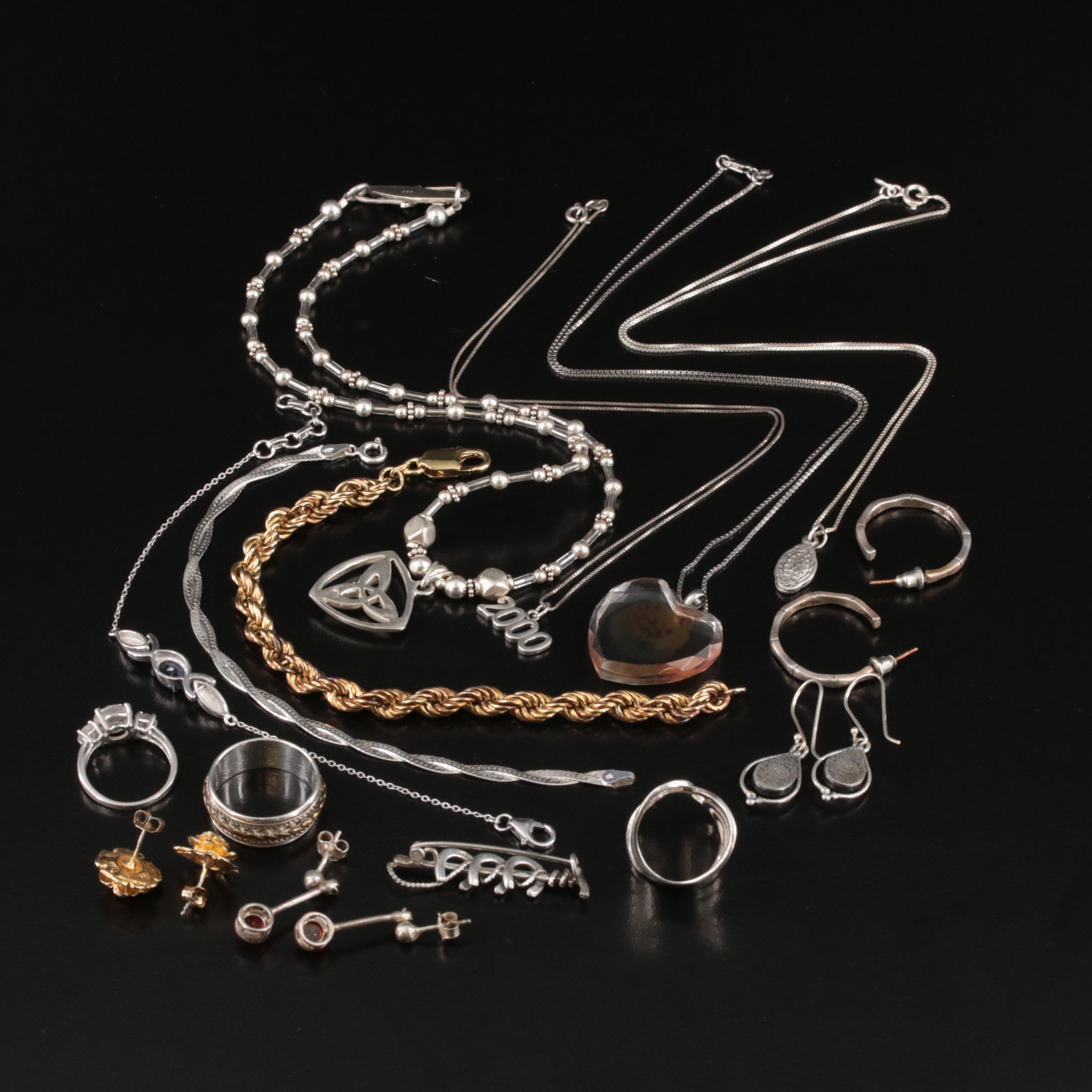 Sterling, Amber and Spinner Ring Featured in Jewelry Assortment