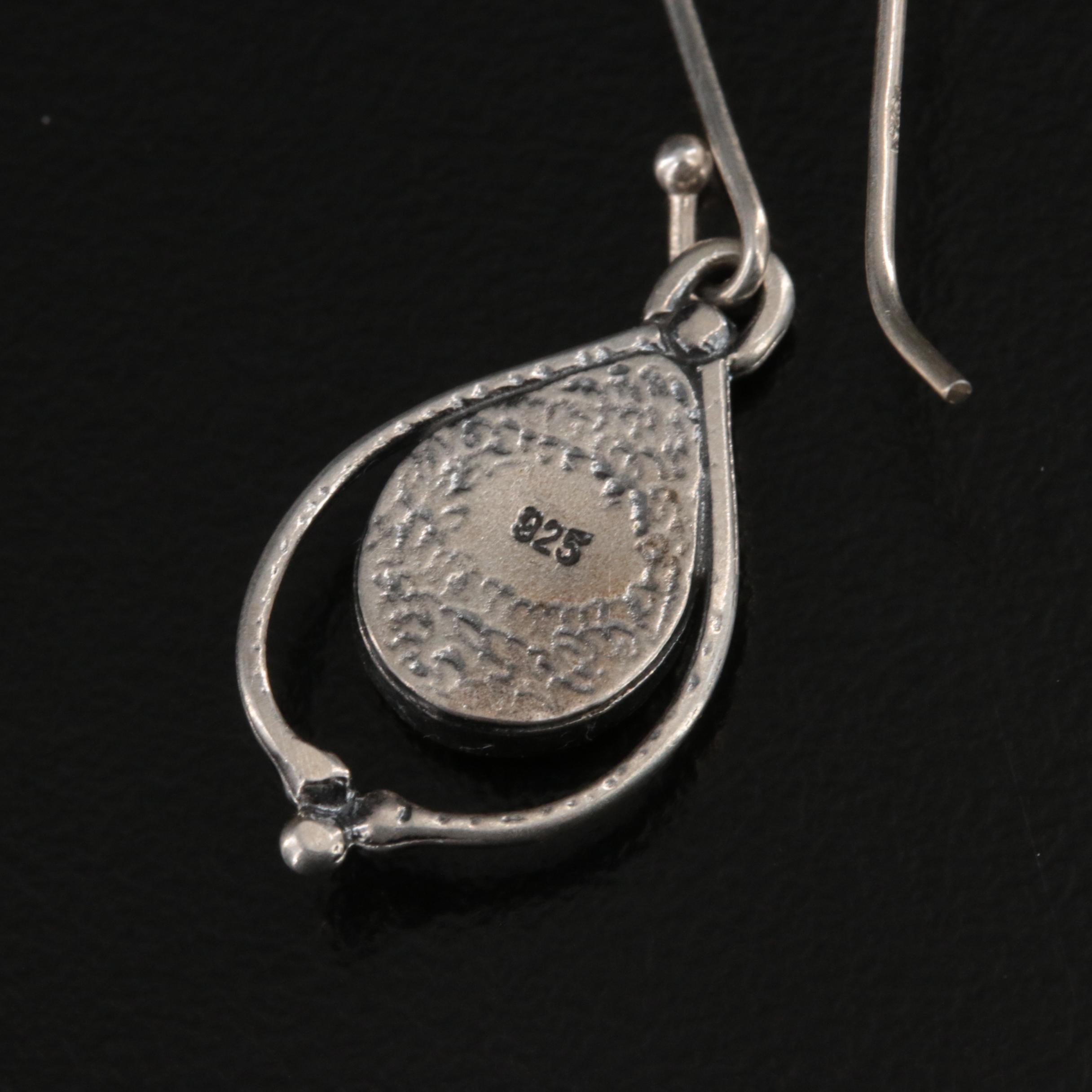 Sterling, Amber and Spinner Ring Featured in Jewelry Assortment