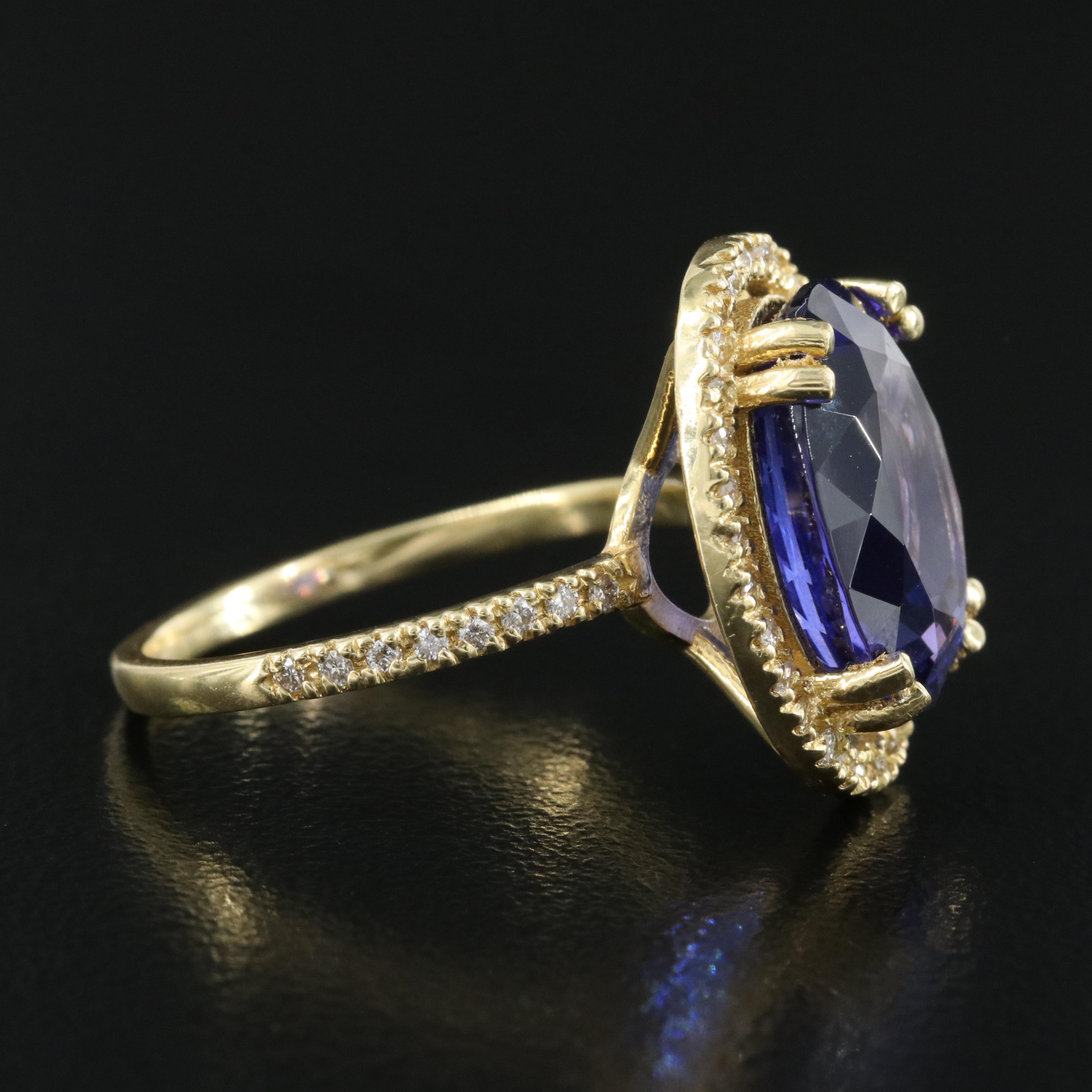 18K 8.52 CT Tanzanite and Diamond Halo Ring