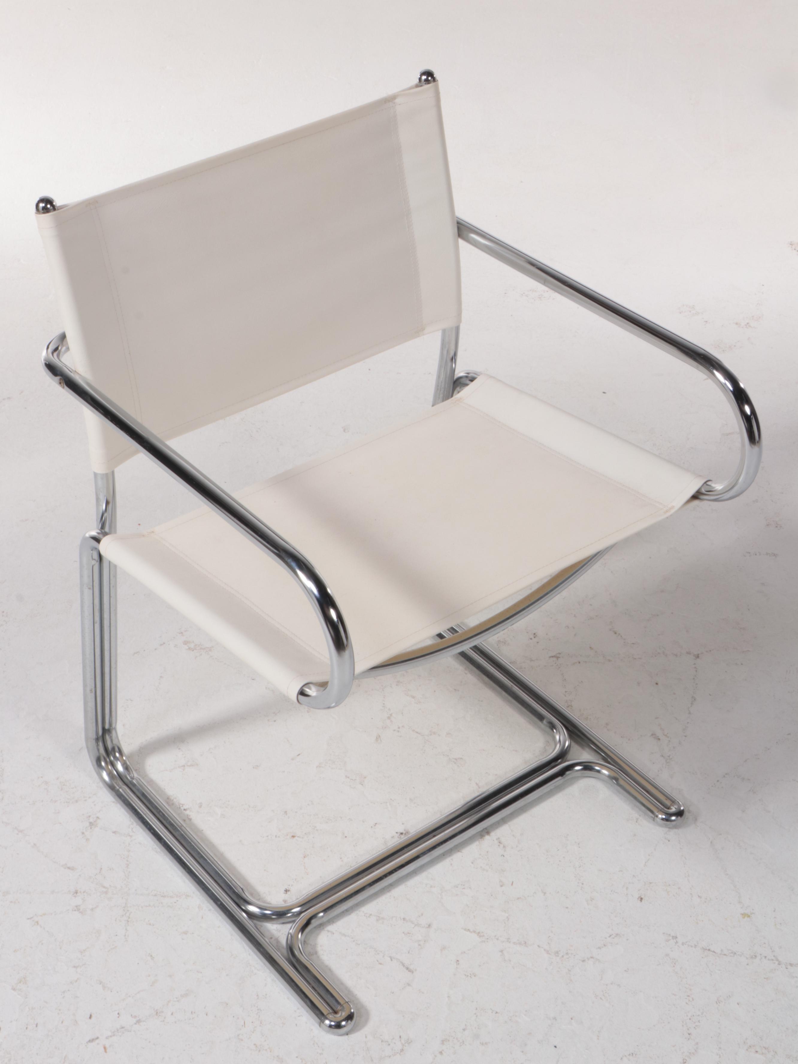Four Modern Chrome Tubular Frame and Canvas Reverse Cantilever Armchairs