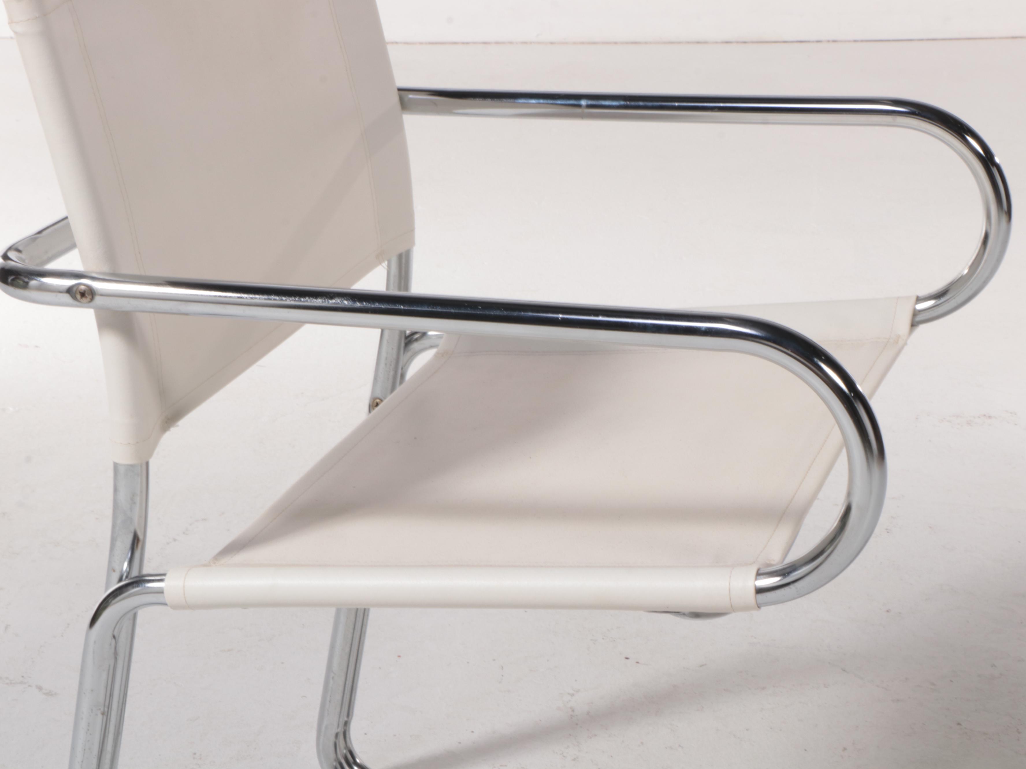 Four Modern Chrome Tubular Frame and Canvas Reverse Cantilever Armchairs