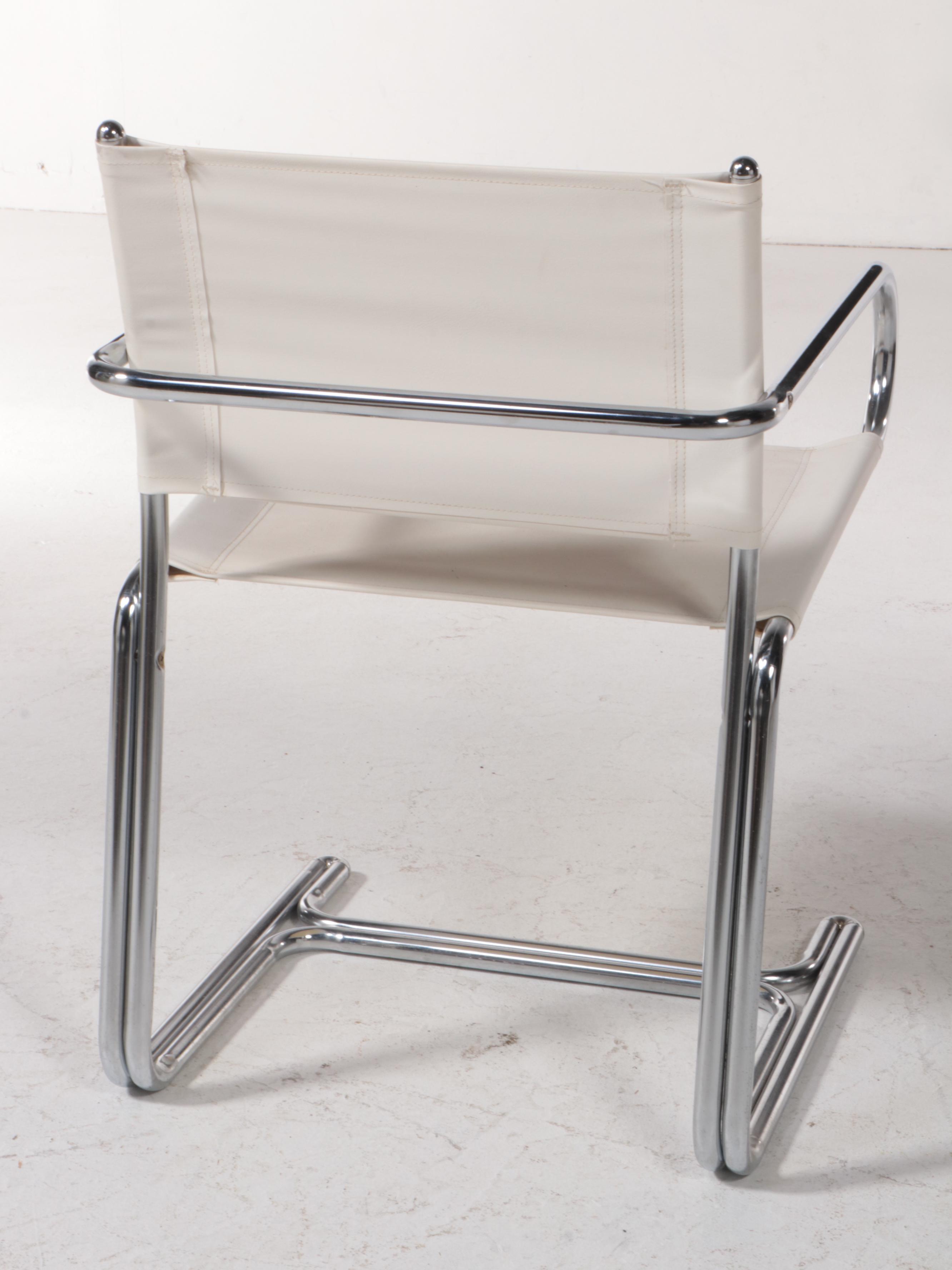 Four Modern Chrome Tubular Frame and Canvas Reverse Cantilever Armchairs