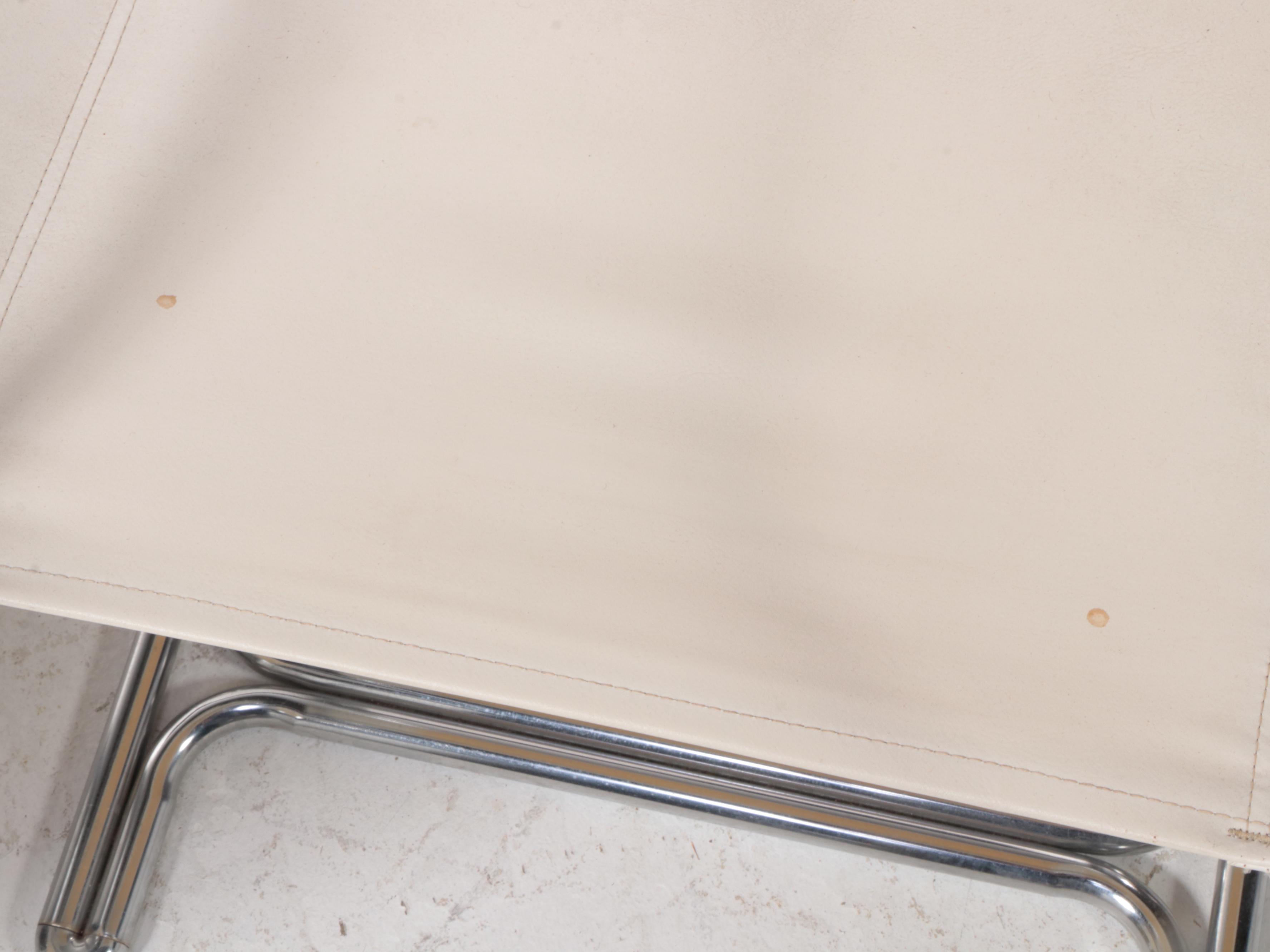 Four Modern Chrome Tubular Frame and Canvas Reverse Cantilever Armchairs