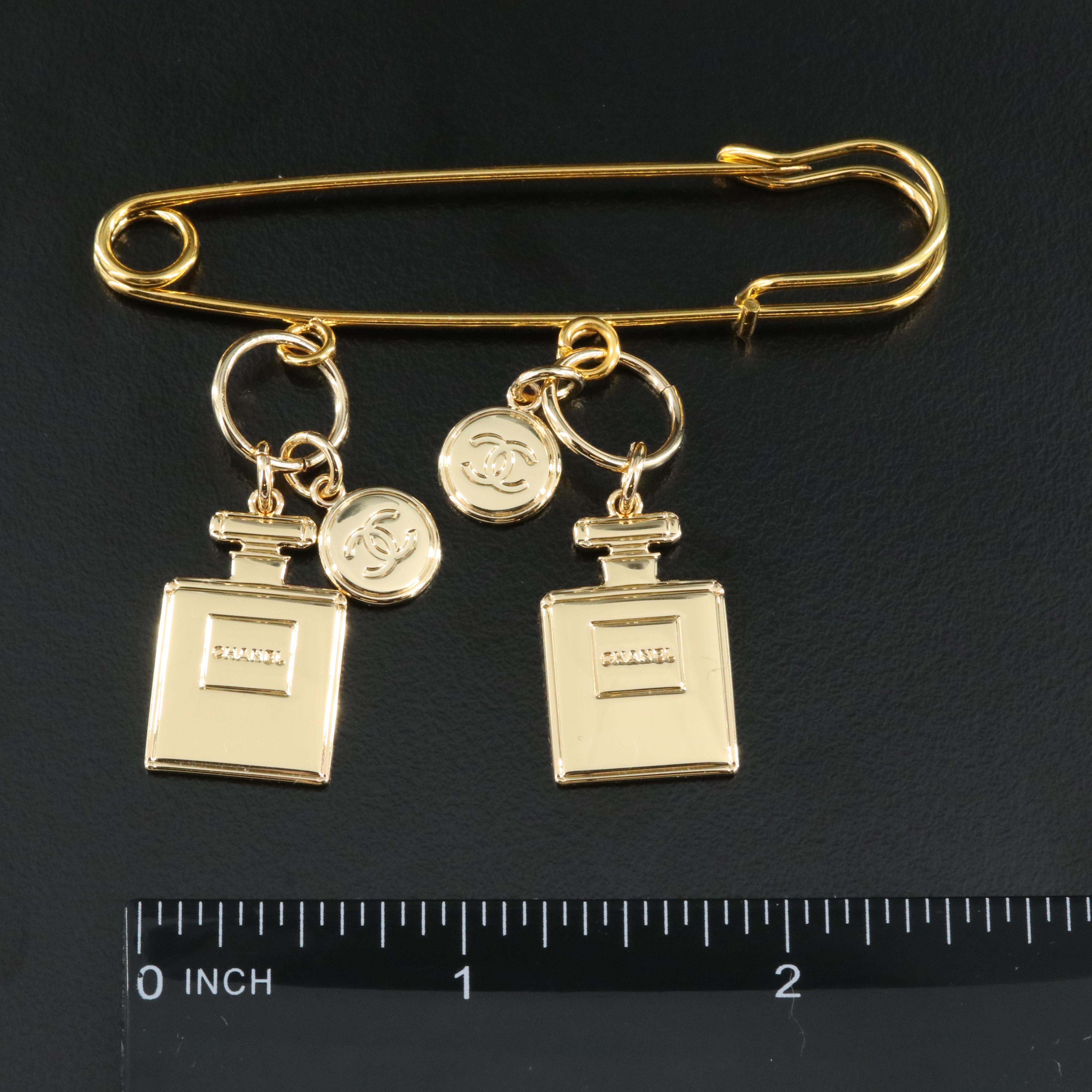 Chanel 2022 Holiday Charms Pins Including Perfume Bottles, Star and Globe
