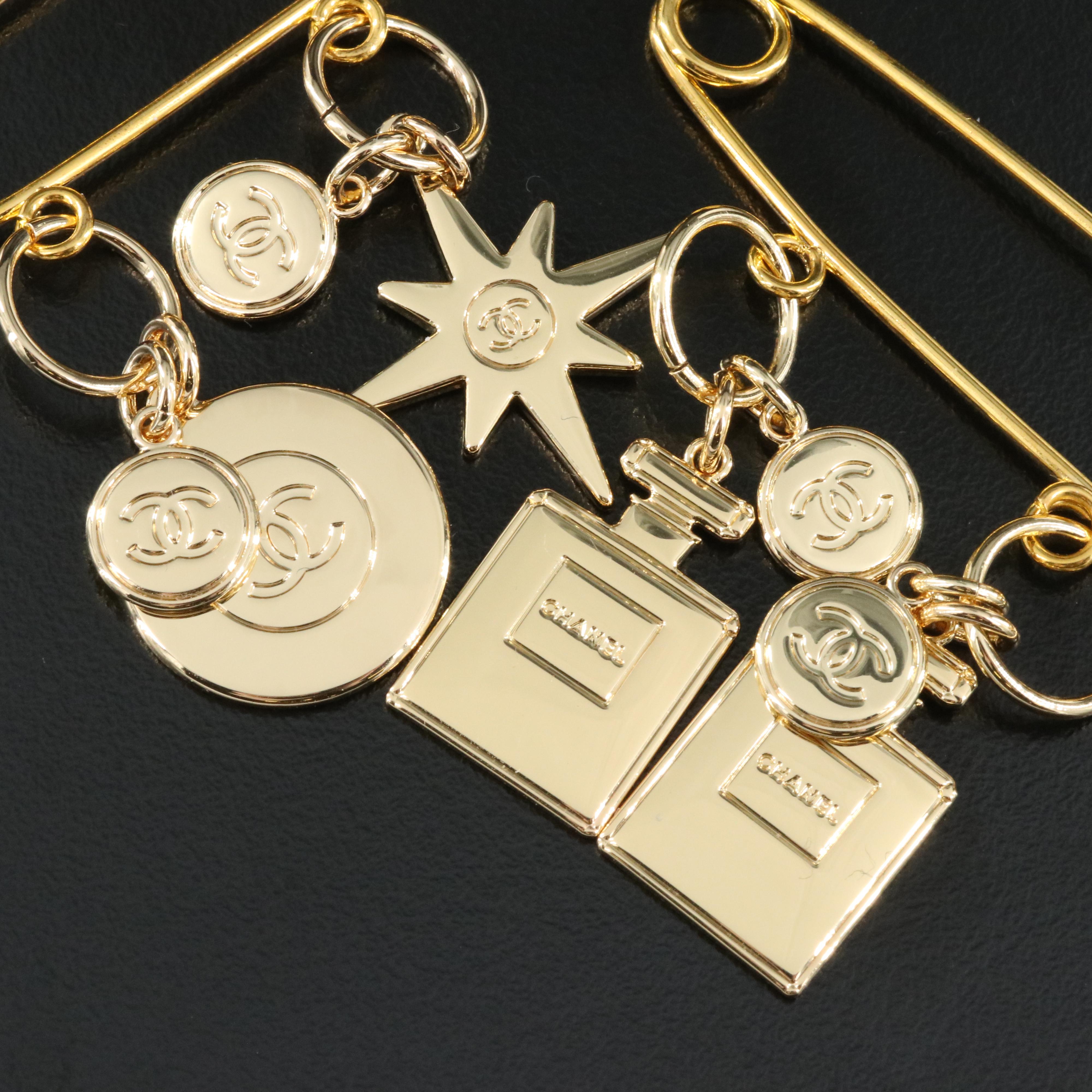 Chanel 2022 Holiday Charms Pins Including Perfume Bottles, Star and Globe