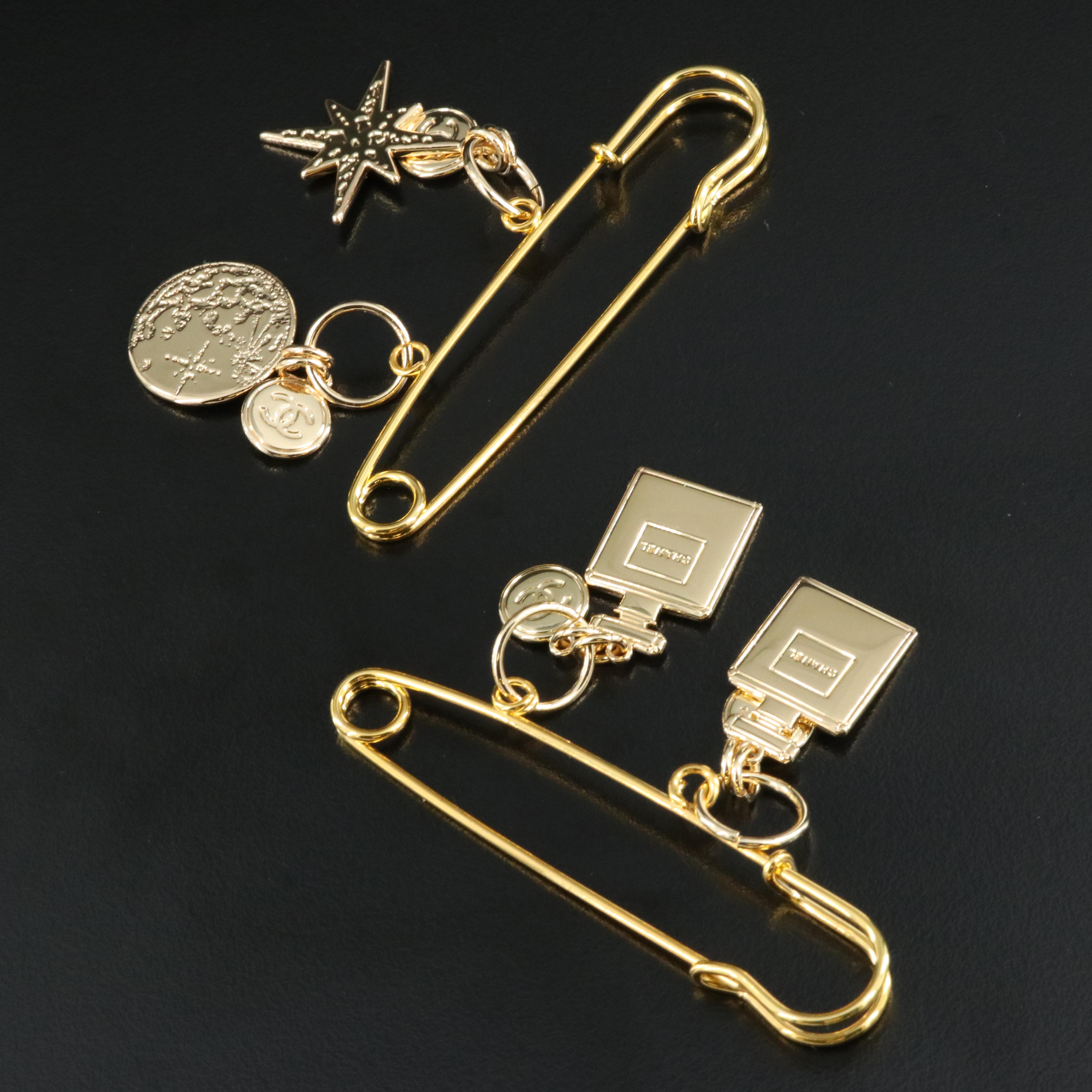 Chanel 2022 Holiday Charms Pins Including Perfume Bottles, Star and Globe