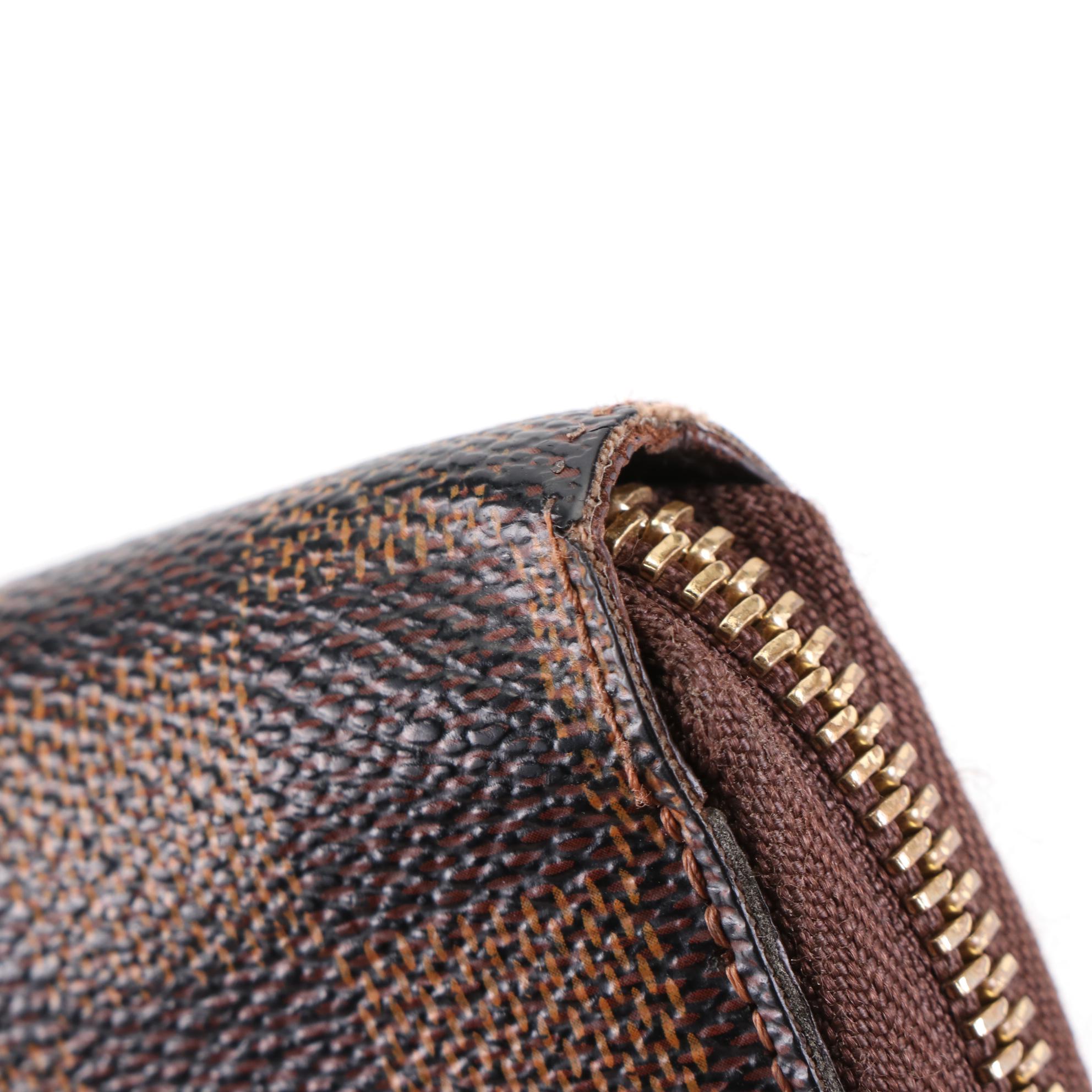 Louis Vuitton Zippy Wallet in Damier Ebene Canvas