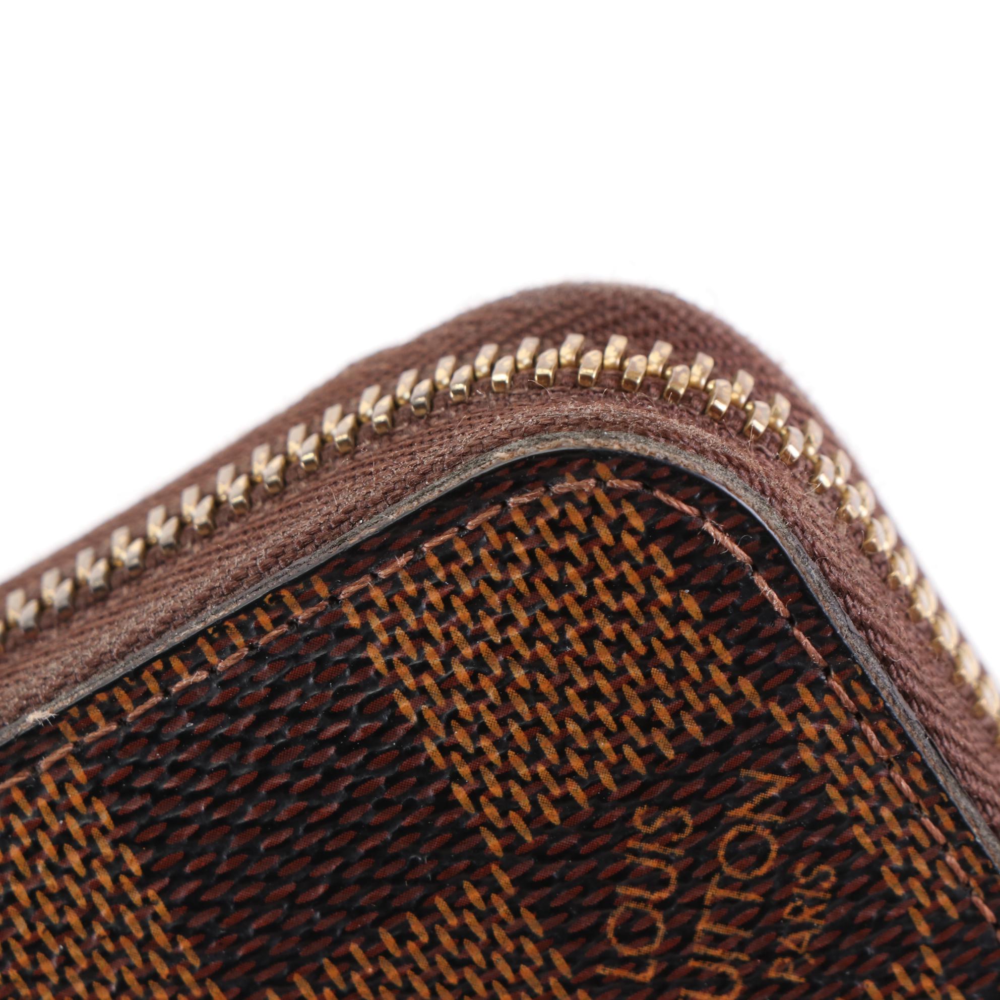 Louis Vuitton Zippy Wallet in Damier Ebene Canvas