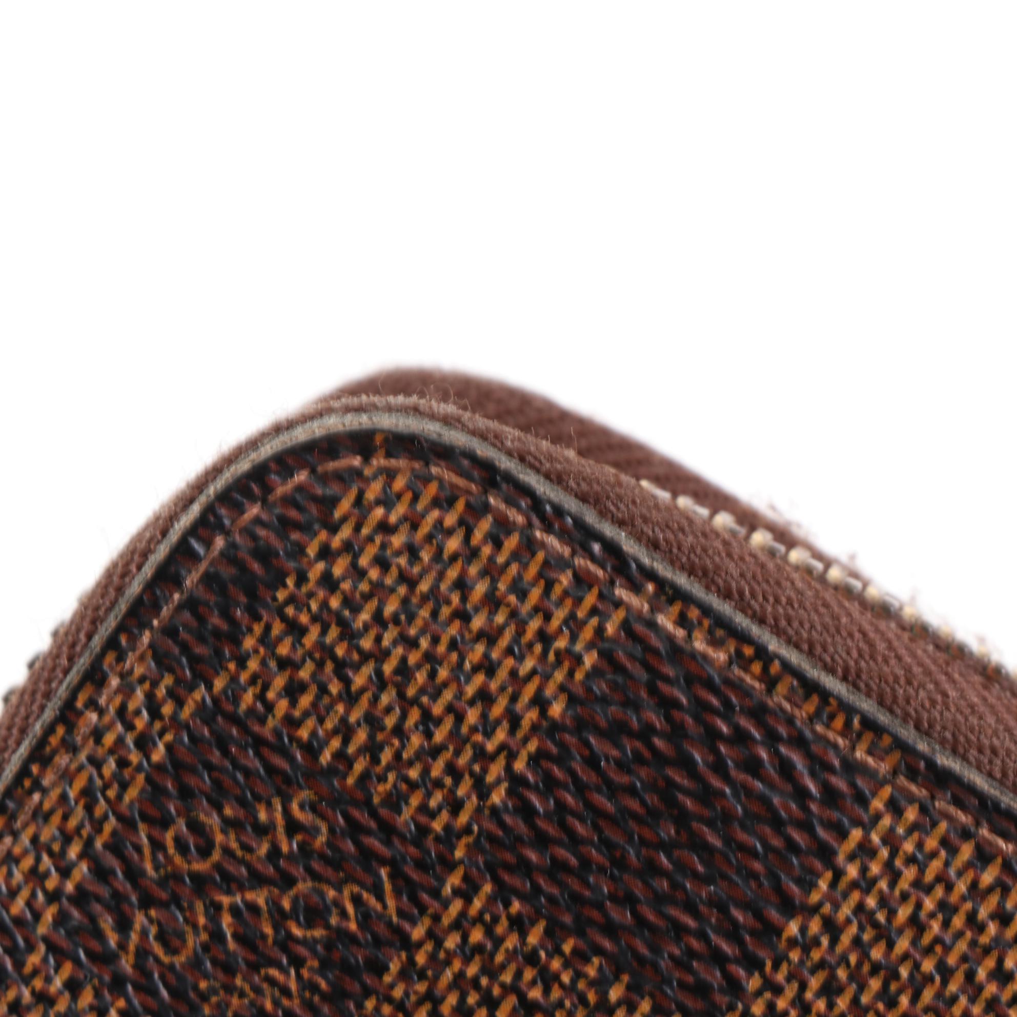 Louis Vuitton Zippy Wallet in Damier Ebene Canvas