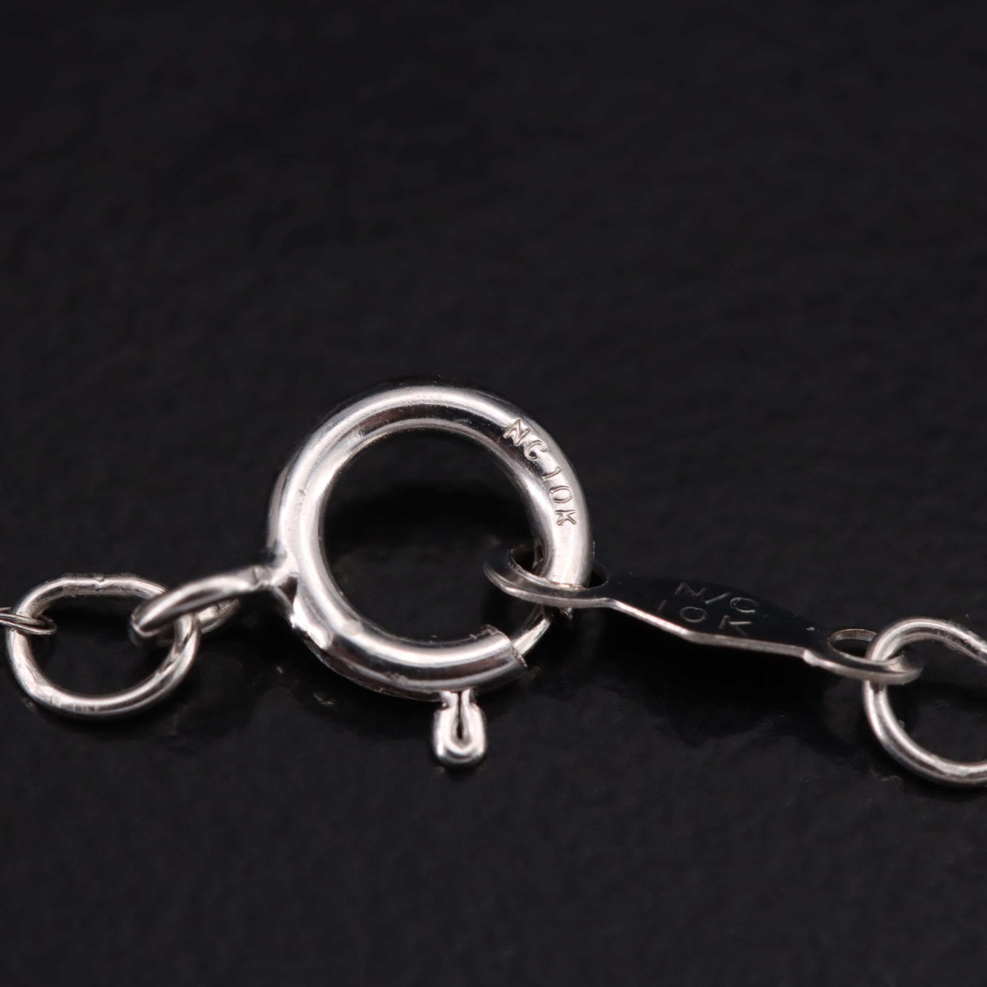 10K 0.63 CTW Diamond Halo Pendant Necklace