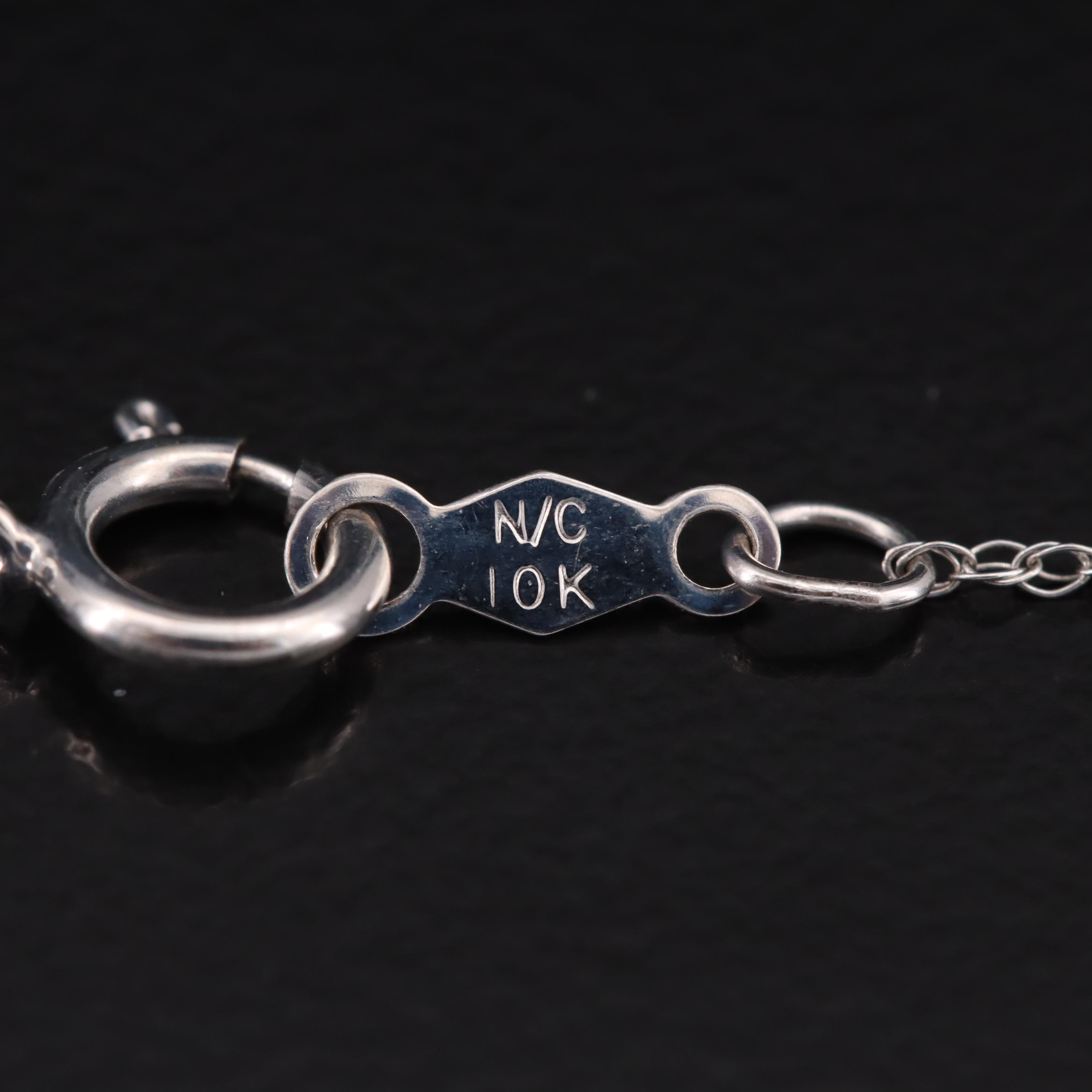 10K 0.63 CTW Diamond Halo Pendant Necklace