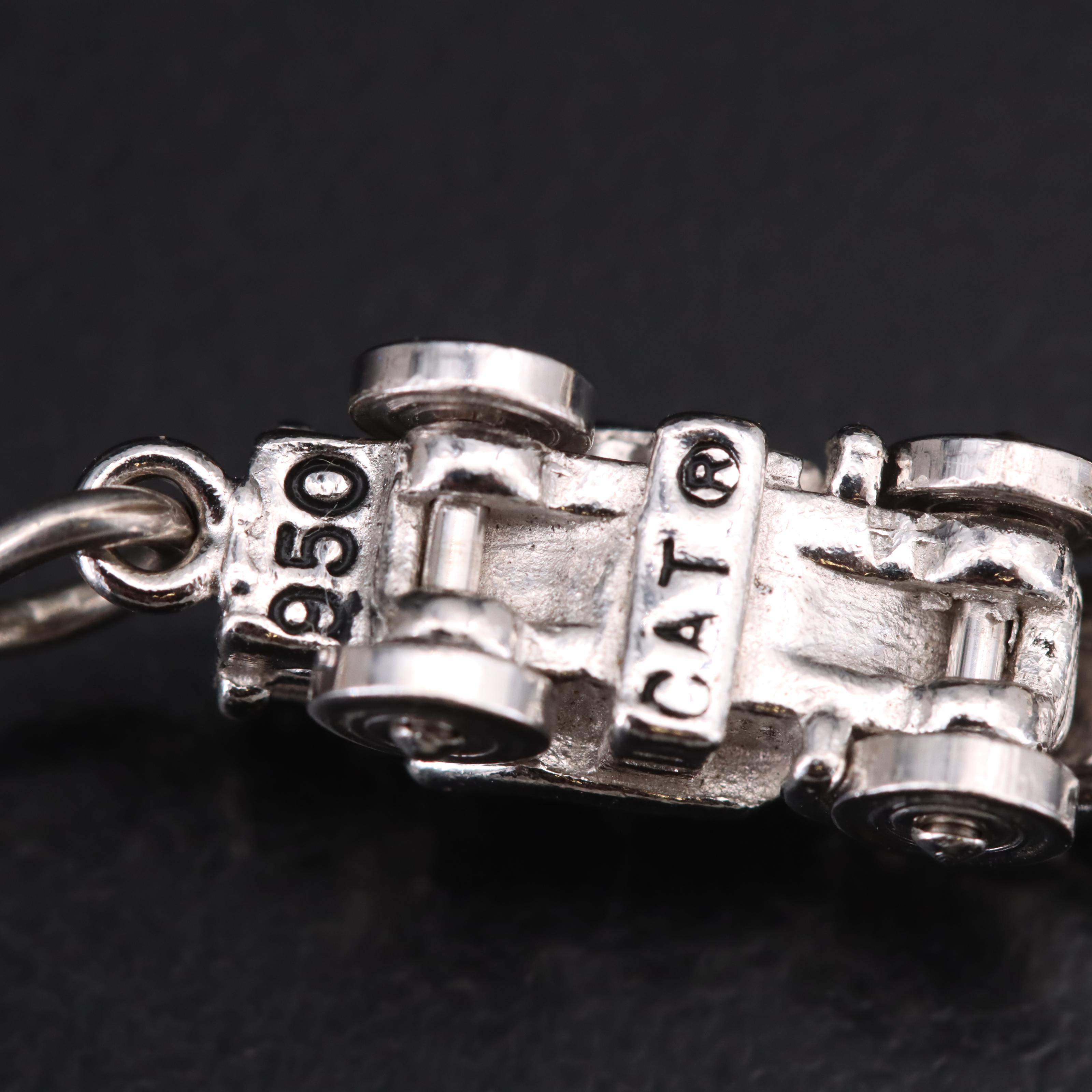 Sterling Charms Including Enamel Accents and 950 Silver Articulating Tractor