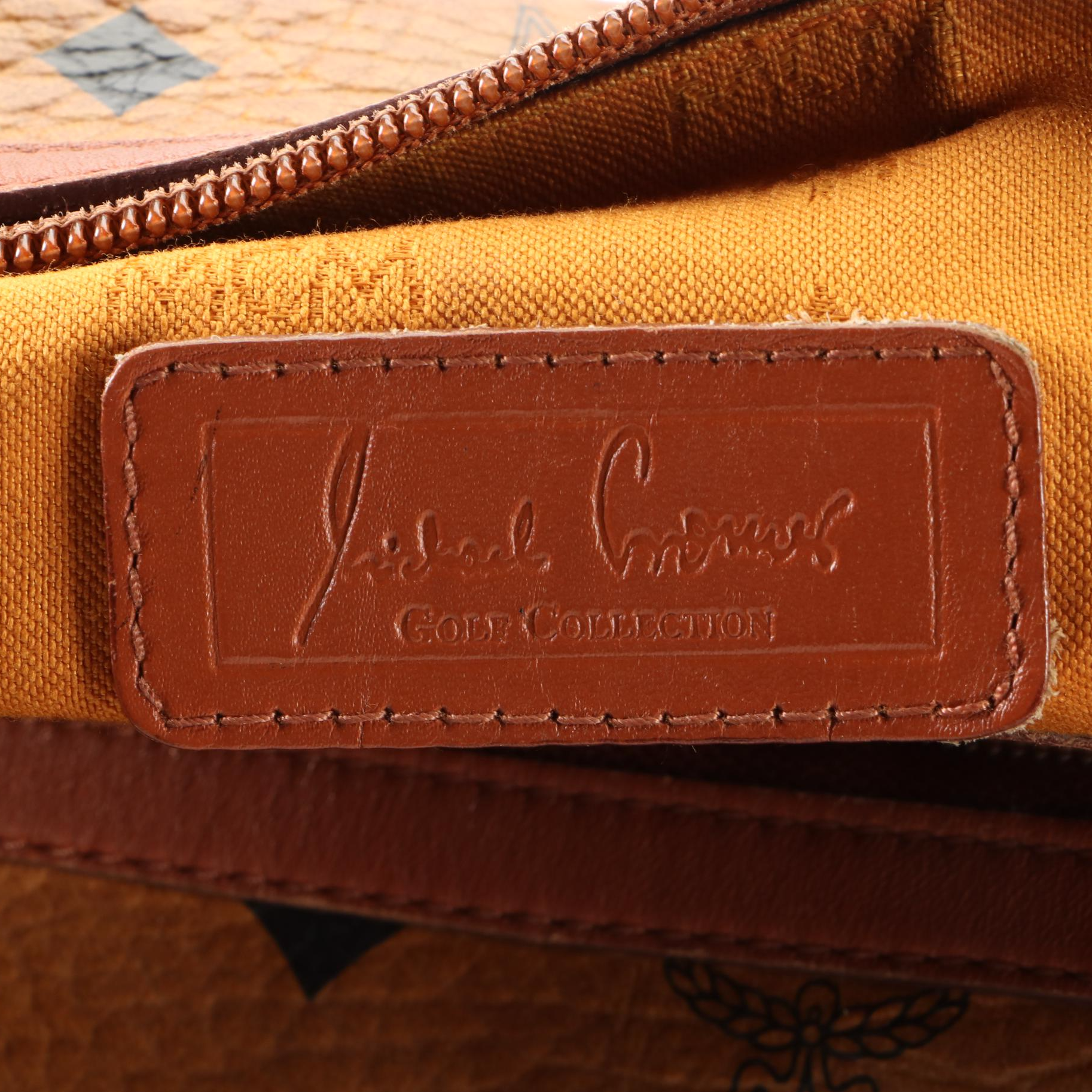 MCM Golf Collection Boston Bag in Visetos Coated Canvas and Cognac Leather