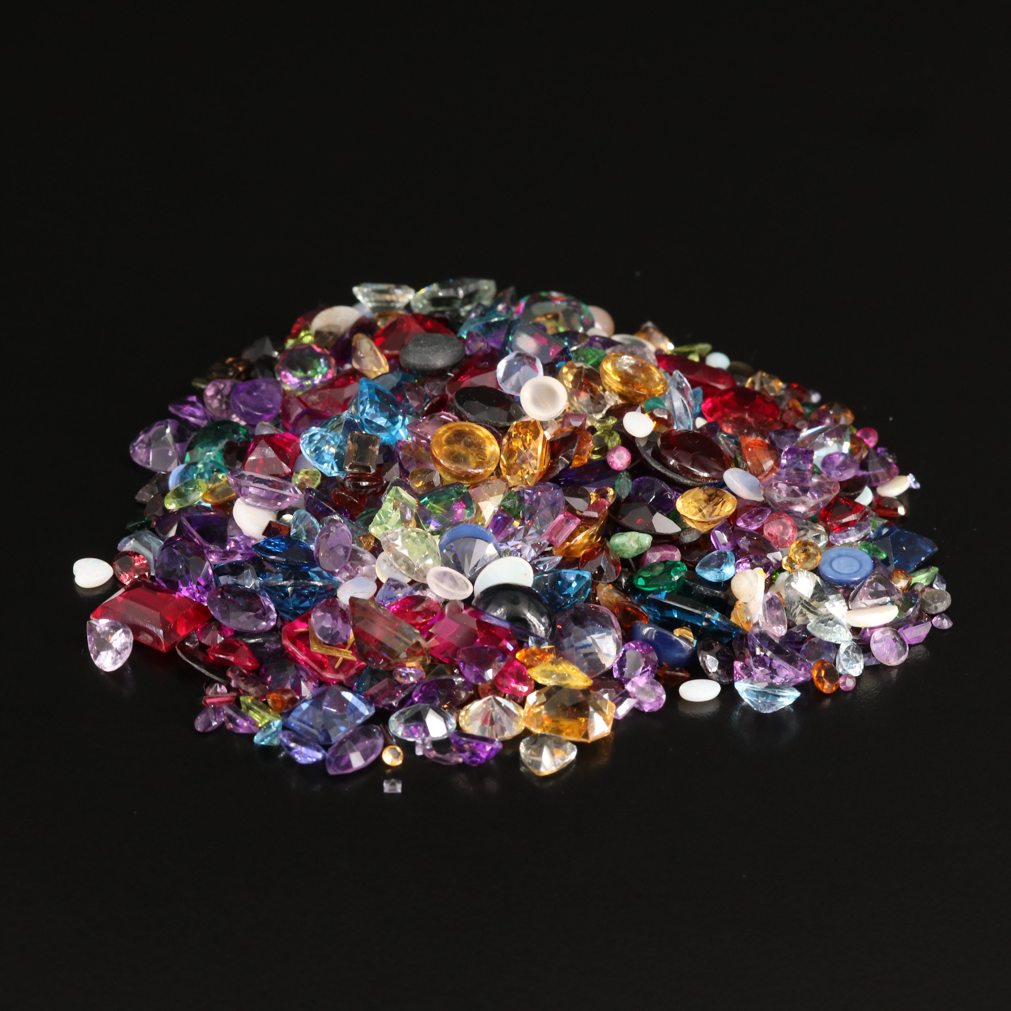 Loose 676.58 CTW Gemstones Including Opal, Topaz and Lab Grown Ruby