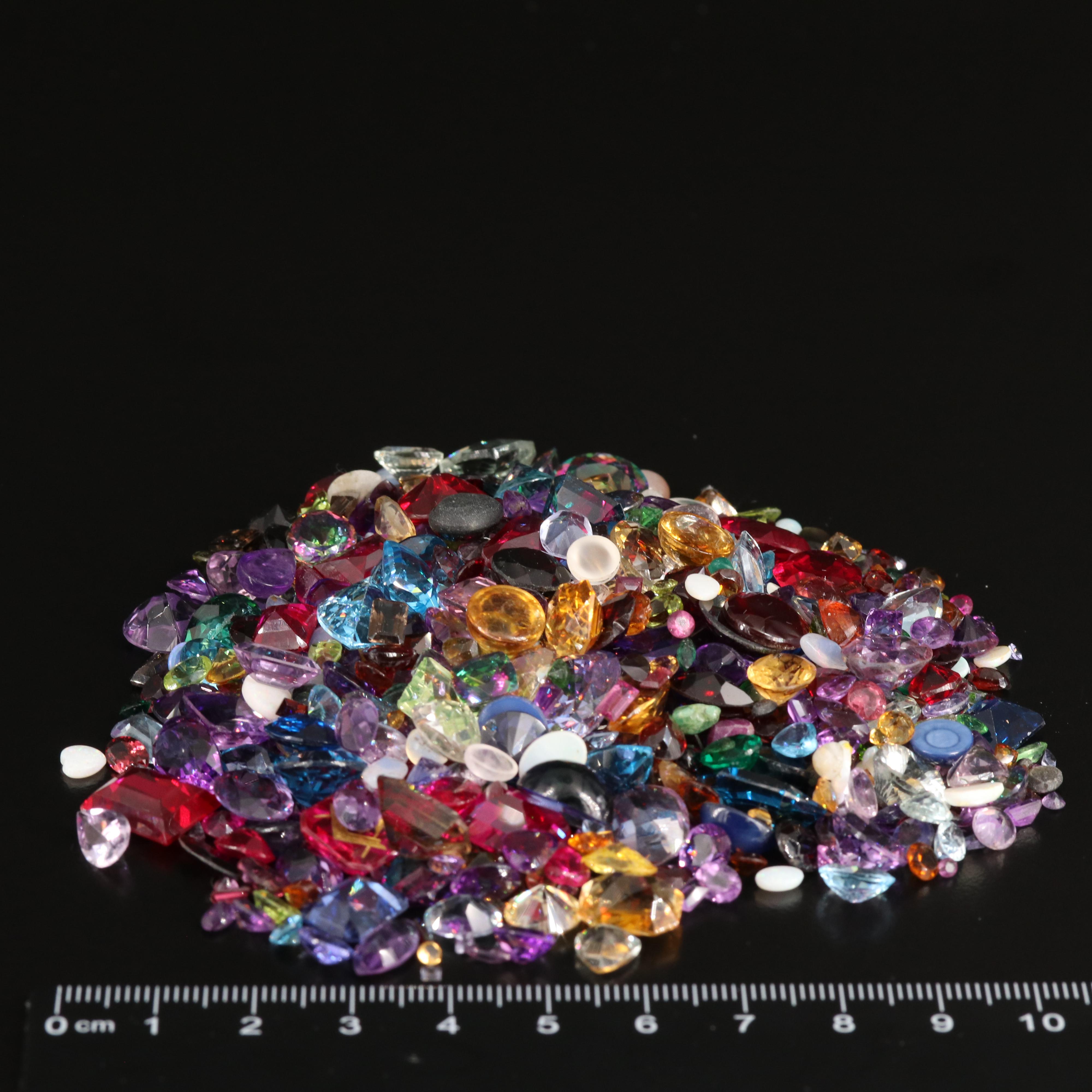 Loose 676.58 CTW Gemstones Including Opal, Topaz and Lab Grown Ruby