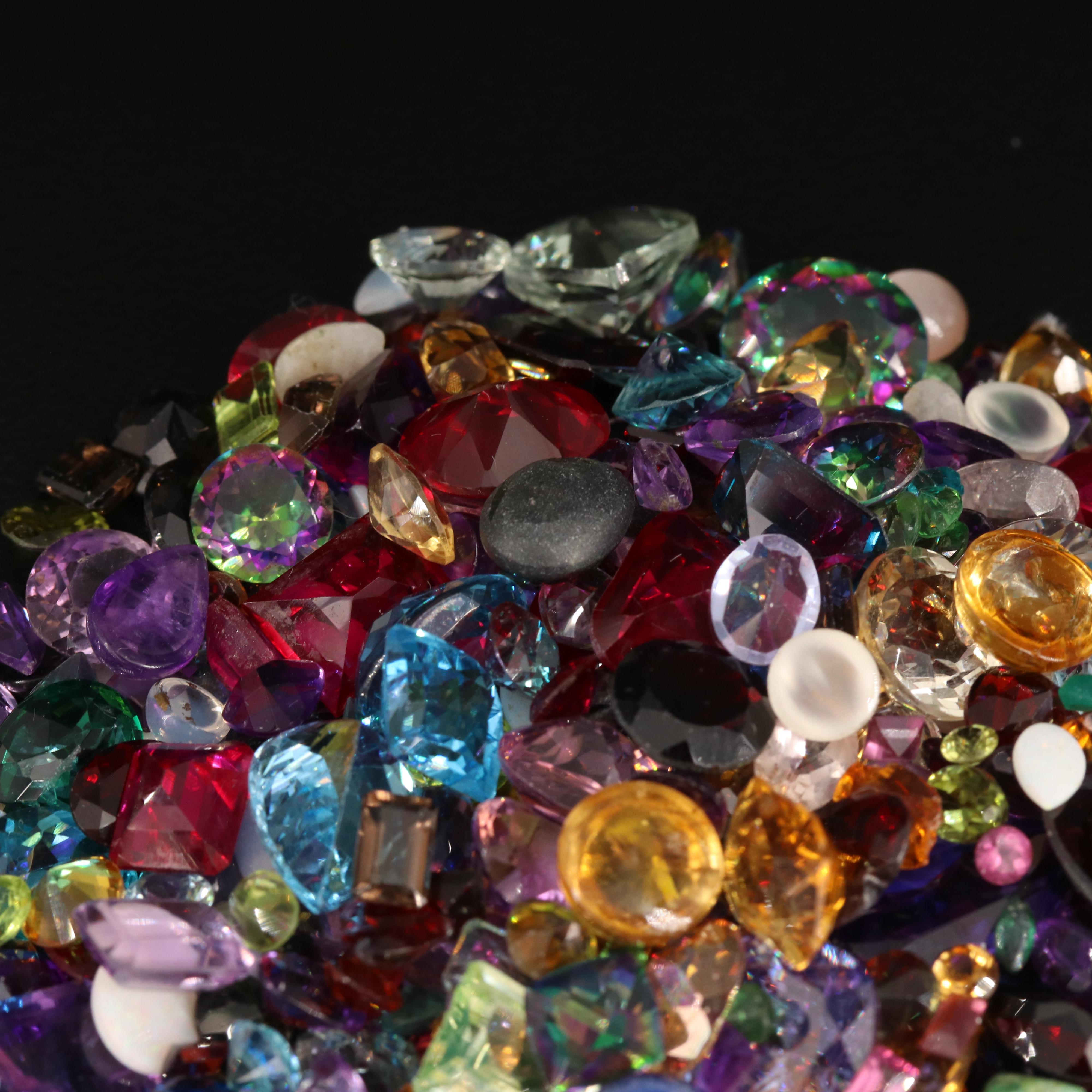 Loose 676.58 CTW Gemstones Including Opal, Topaz and Lab Grown Ruby