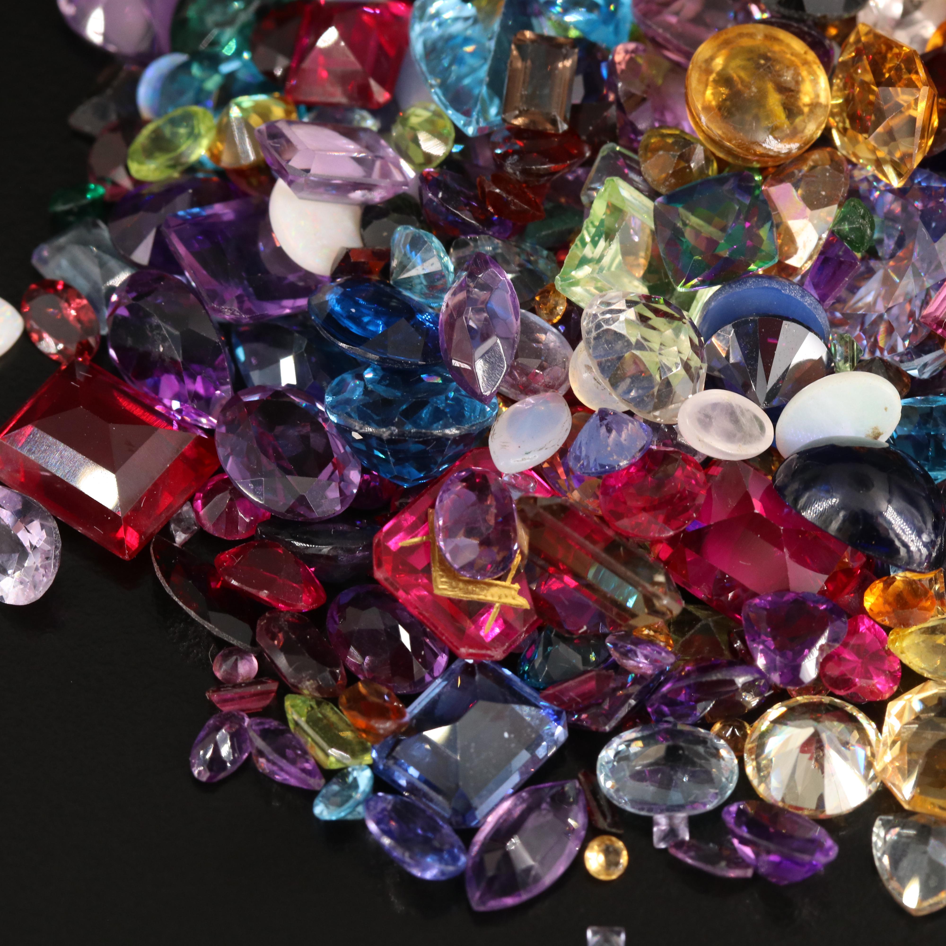 Loose 676.58 CTW Gemstones Including Opal, Topaz and Lab Grown Ruby