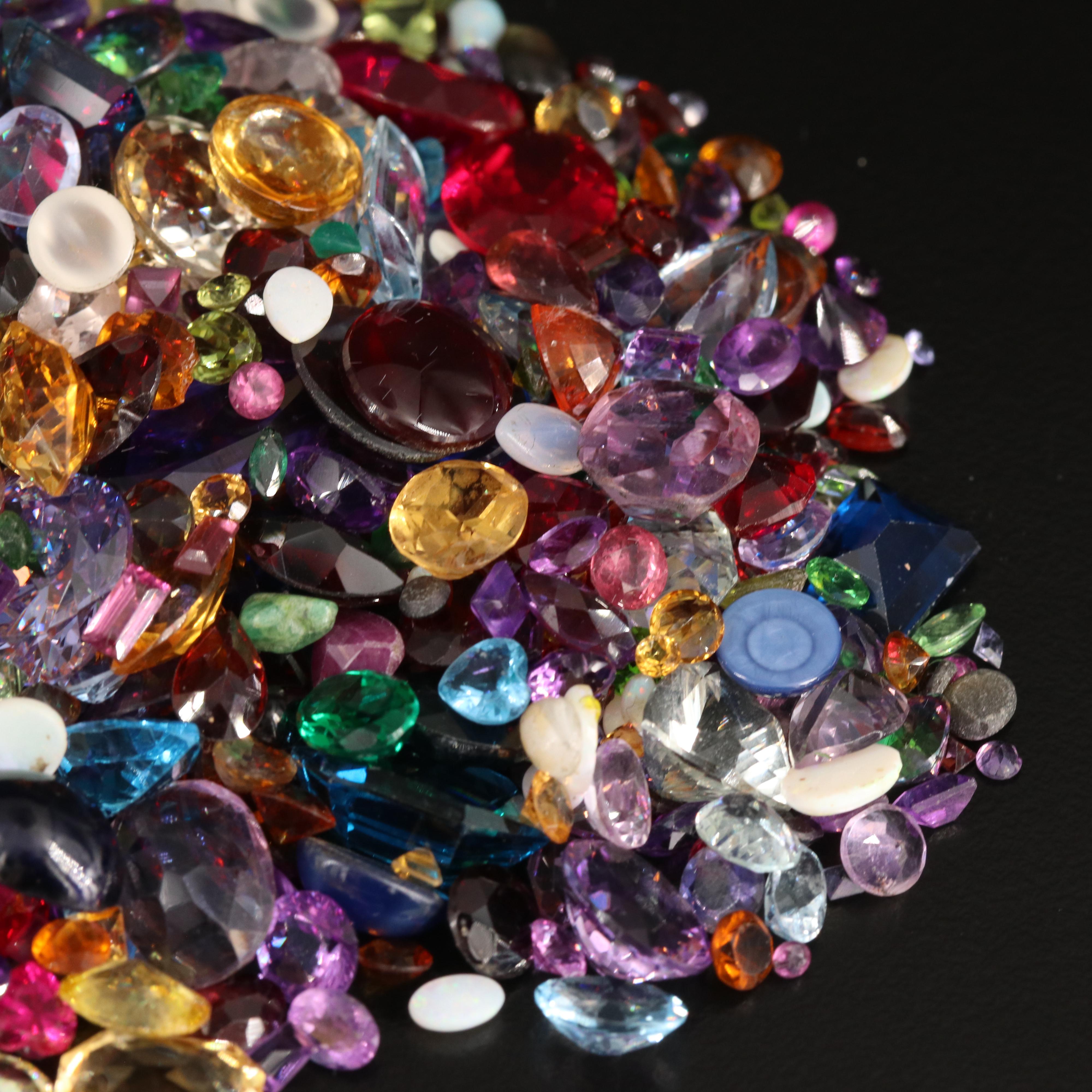 Loose 676.58 CTW Gemstones Including Opal, Topaz and Lab Grown Ruby