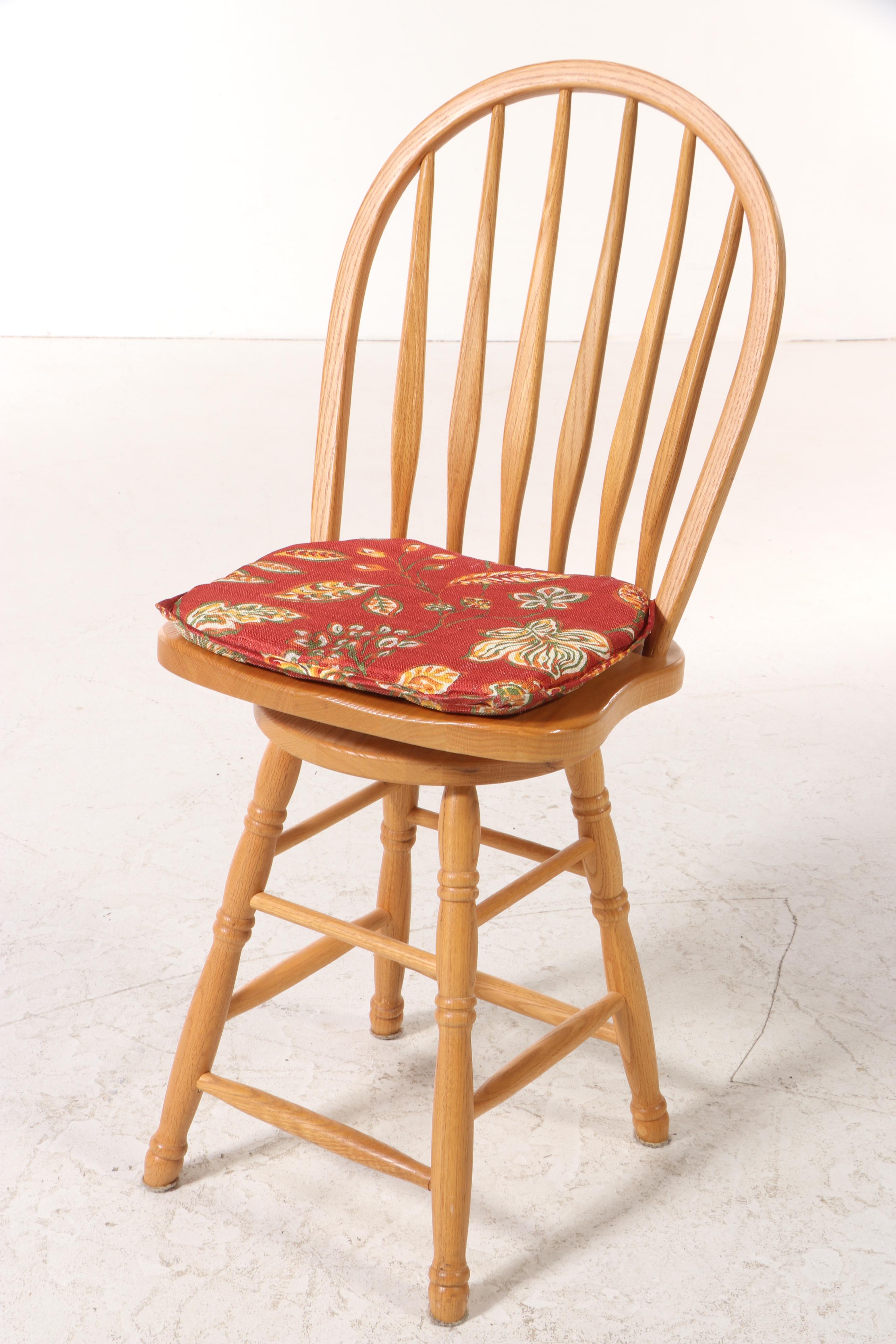 Four American Colonial Style Oak Swivel Windsor Counter Stools