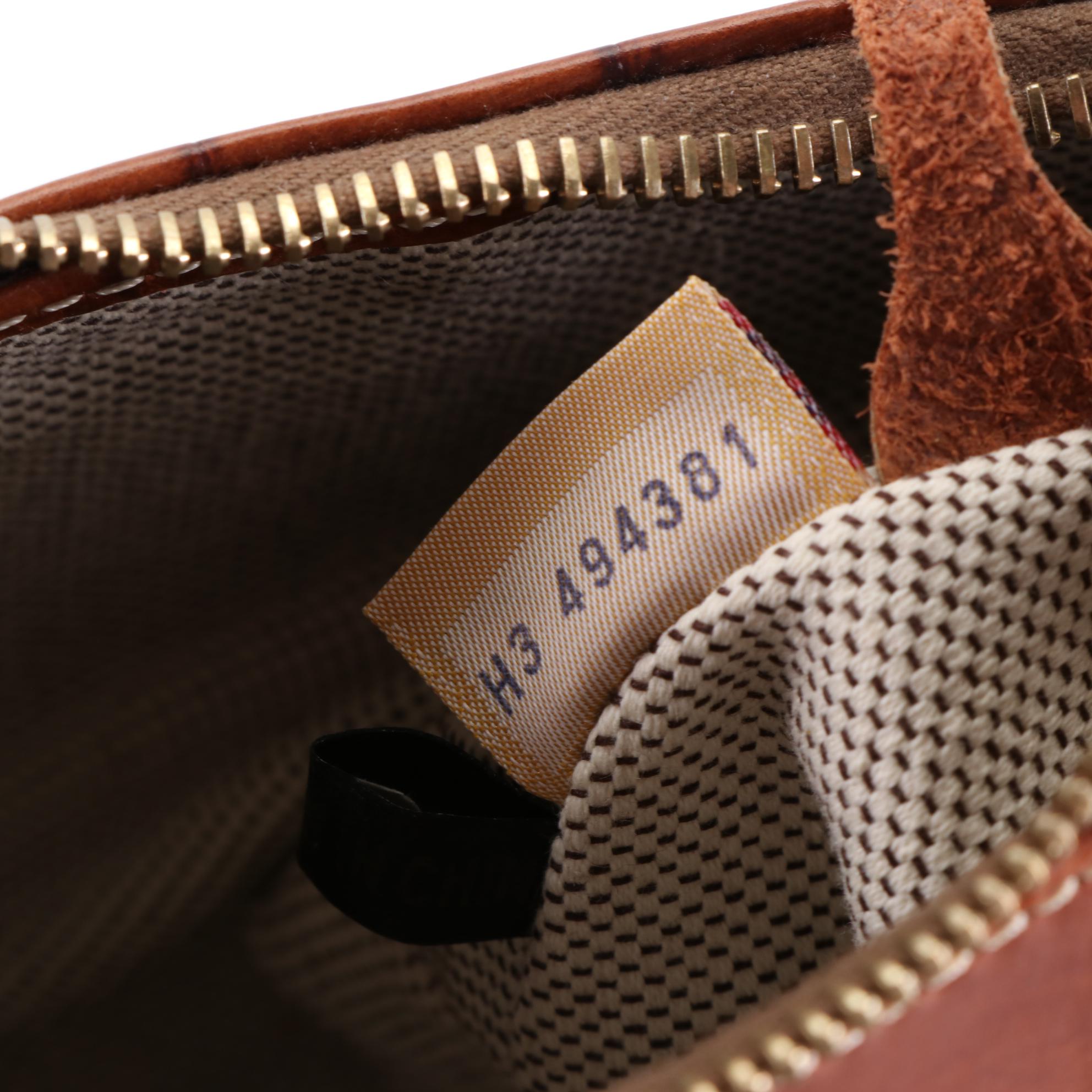 Dooney & Bourke Shoulder Bags in Black and Brown Croc-Effect Leather