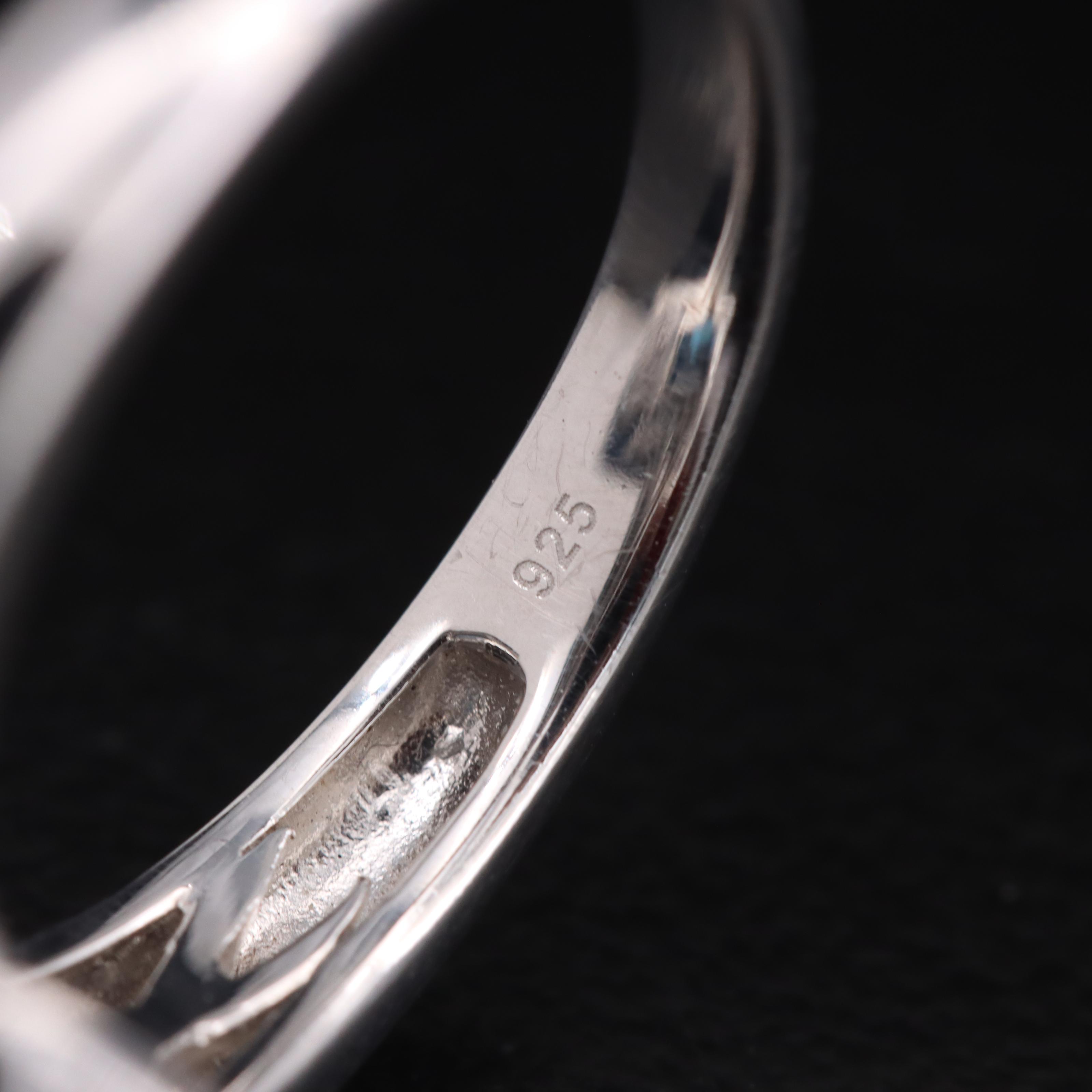 Sterling Swiss Blue Topaz and Diamond Halo Ring