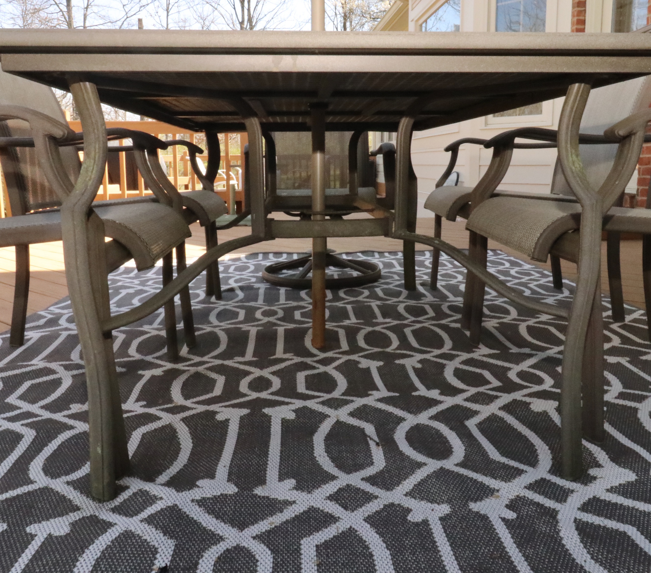 Cast Aluminum Outdoor Dining Set with Sling Mesh Seating, Umbrella and Area Rug