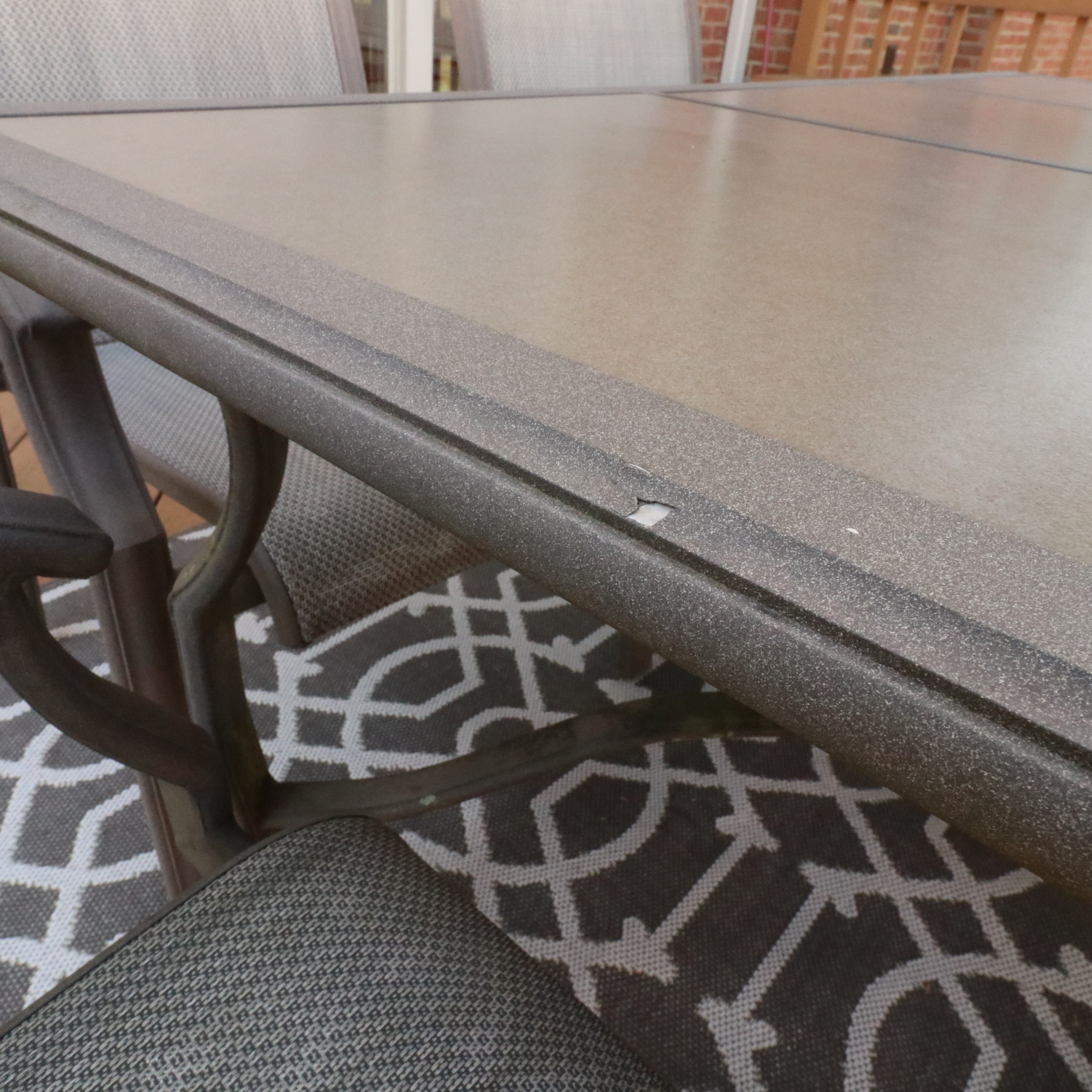 Cast Aluminum Outdoor Dining Set with Sling Mesh Seating, Umbrella and Area Rug