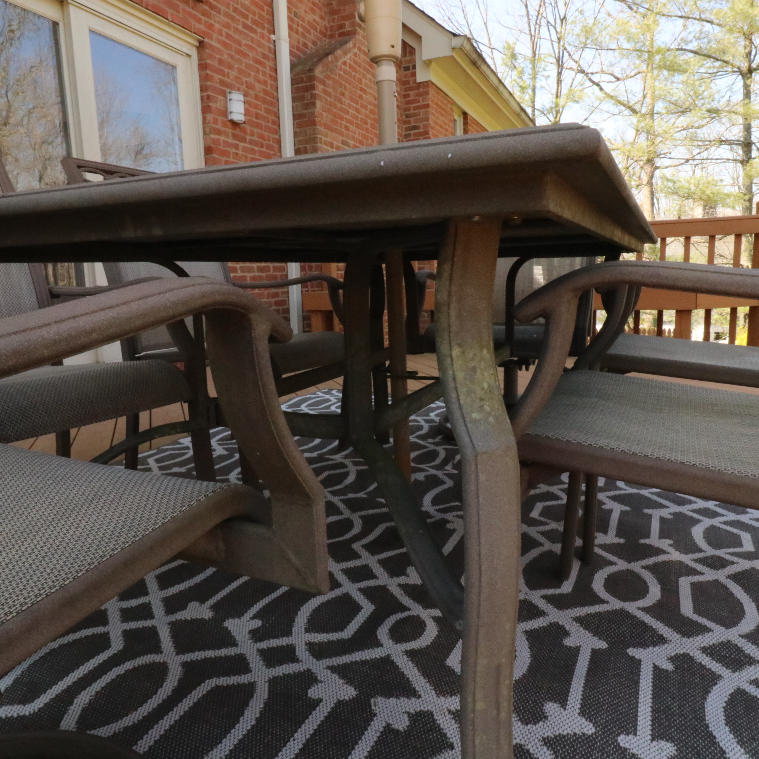 Cast Aluminum Outdoor Dining Set with Sling Mesh Seating, Umbrella and Area Rug