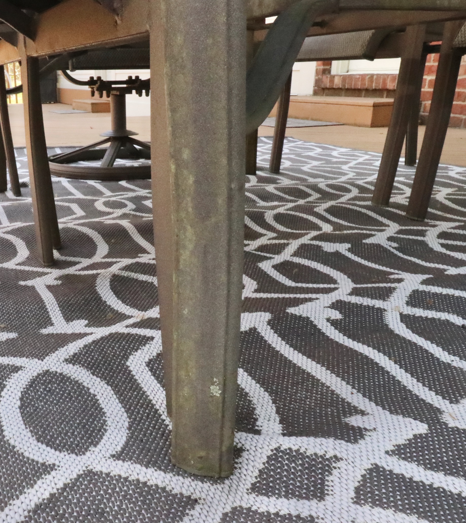 Cast Aluminum Outdoor Dining Set with Sling Mesh Seating, Umbrella and Area Rug