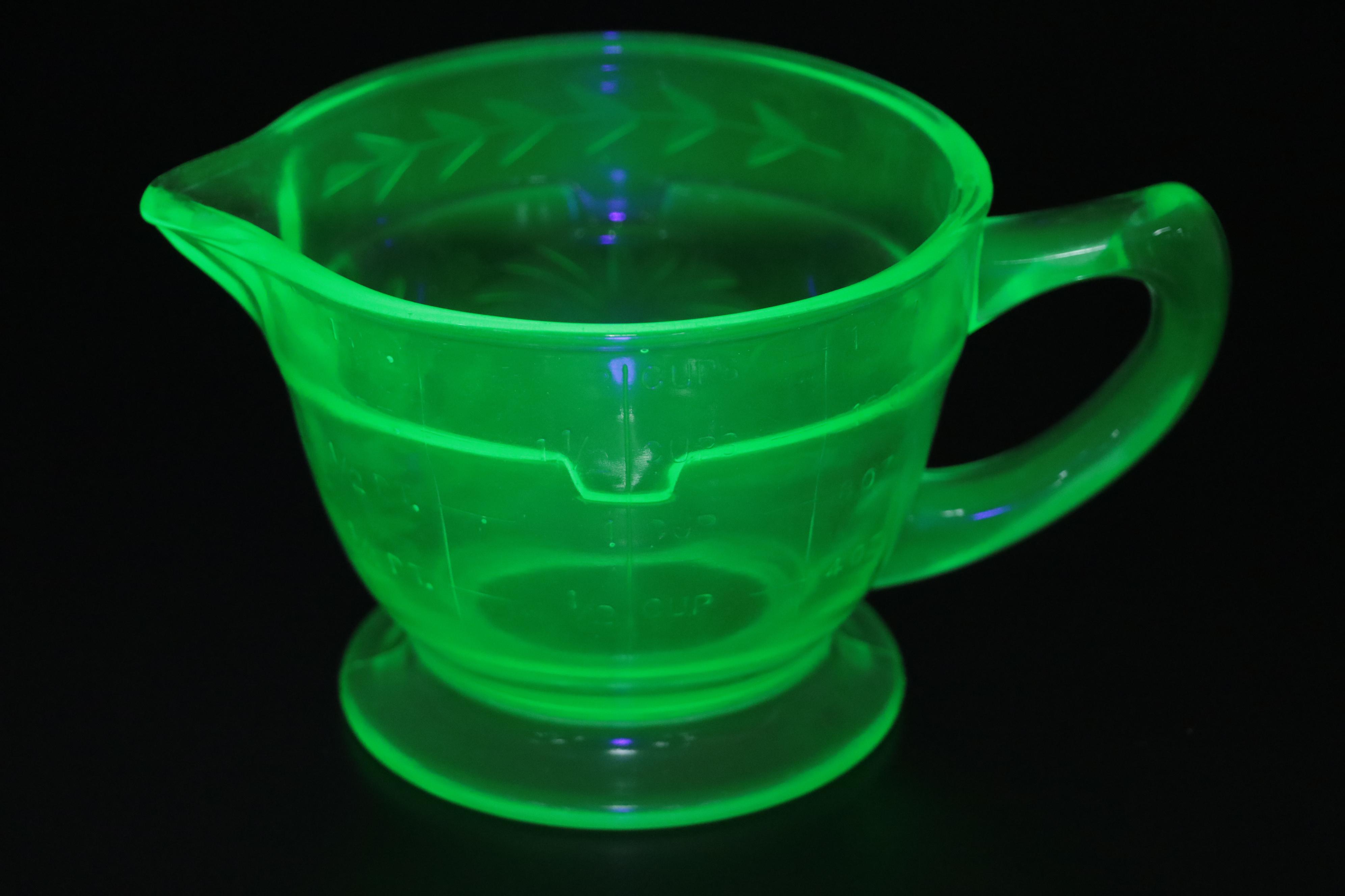 Uranium Glass and Other Measuring Cups with Egg Scale and Other Household Items