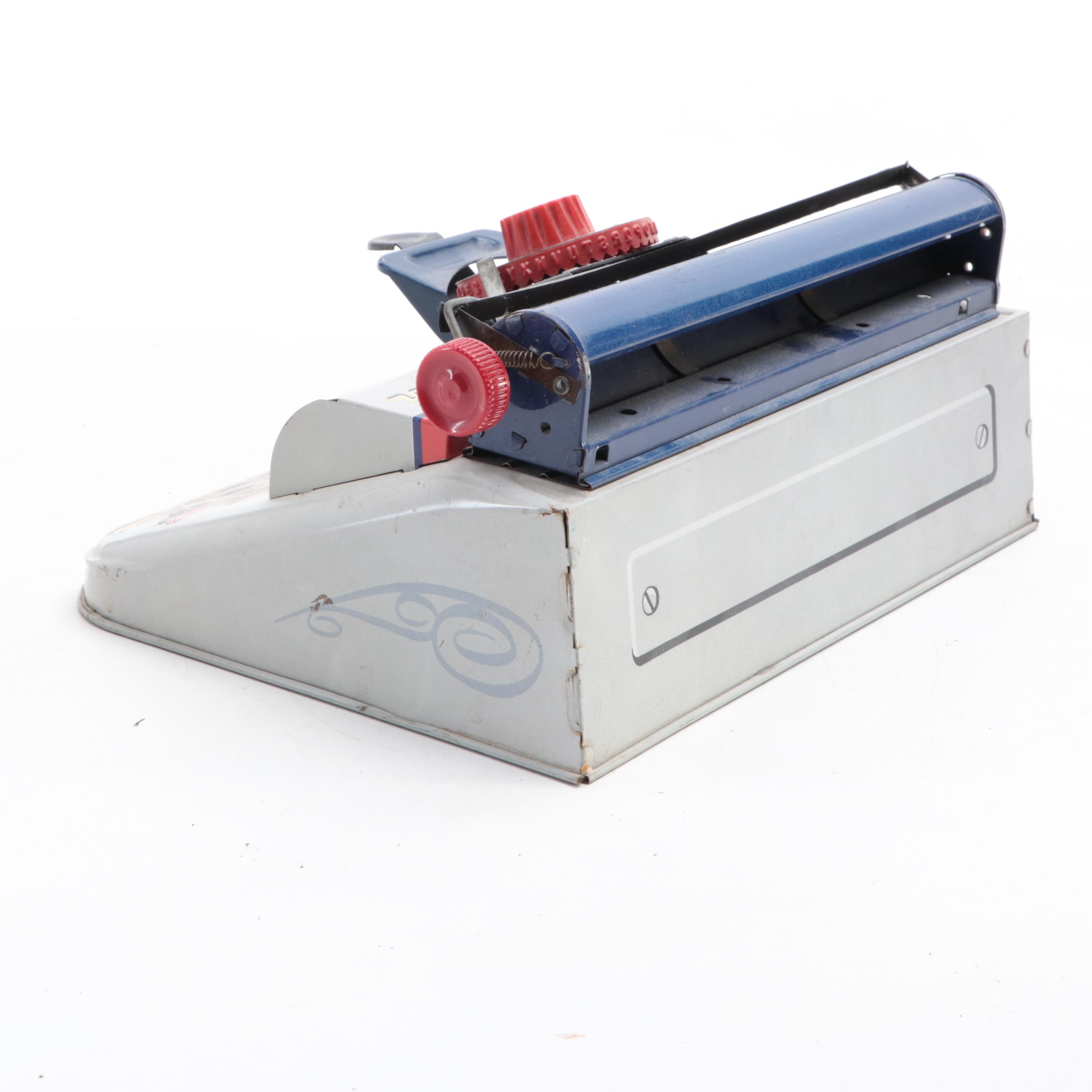 Marx Tin Lithograph “Junior" Dial Typewriter, Mid-20th Century