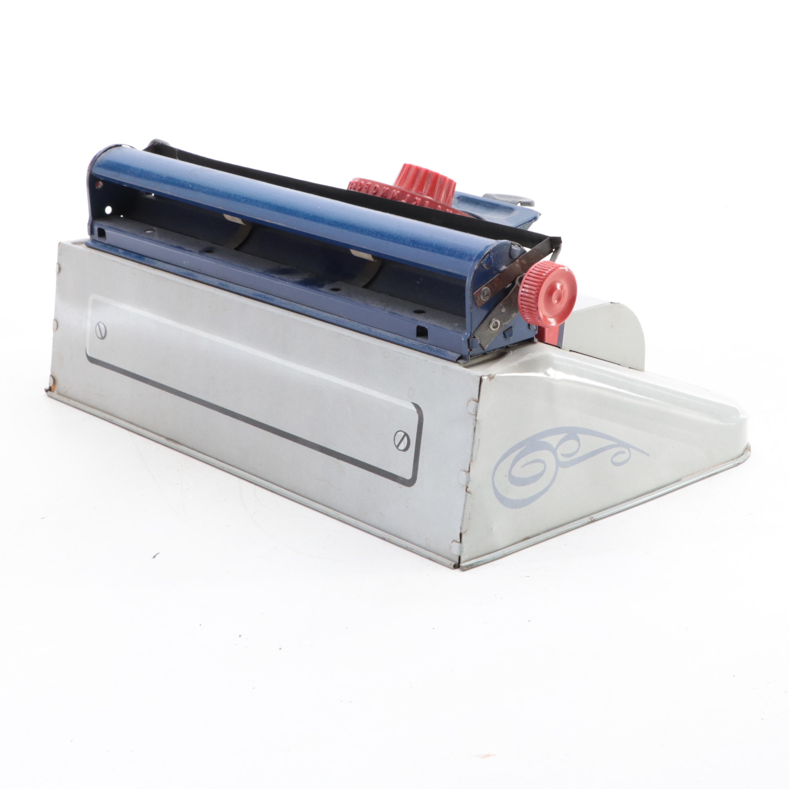 Marx Tin Lithograph “Junior" Dial Typewriter, Mid-20th Century