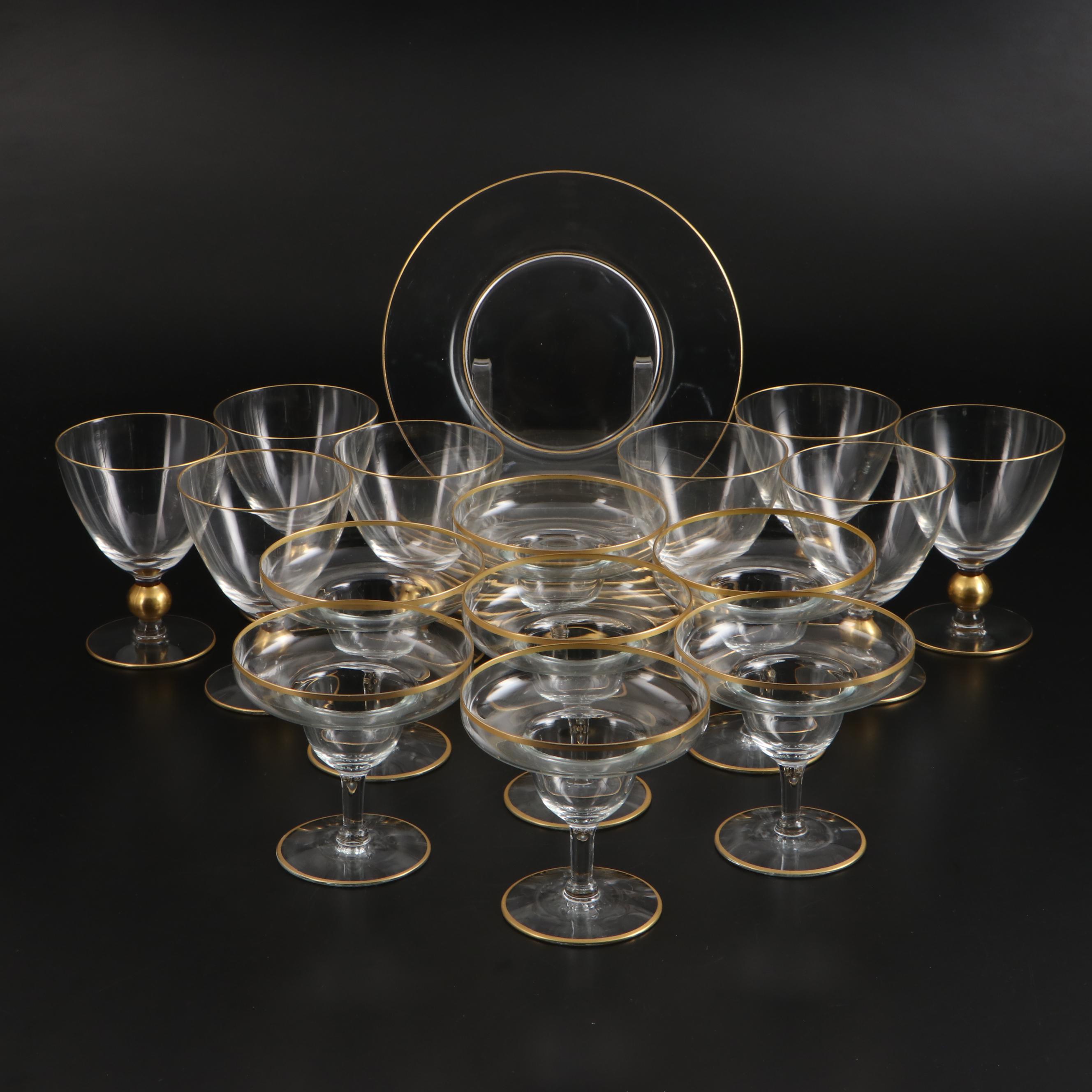 Gold Rimmed Glass Plates with Wine and Champagne Glasses