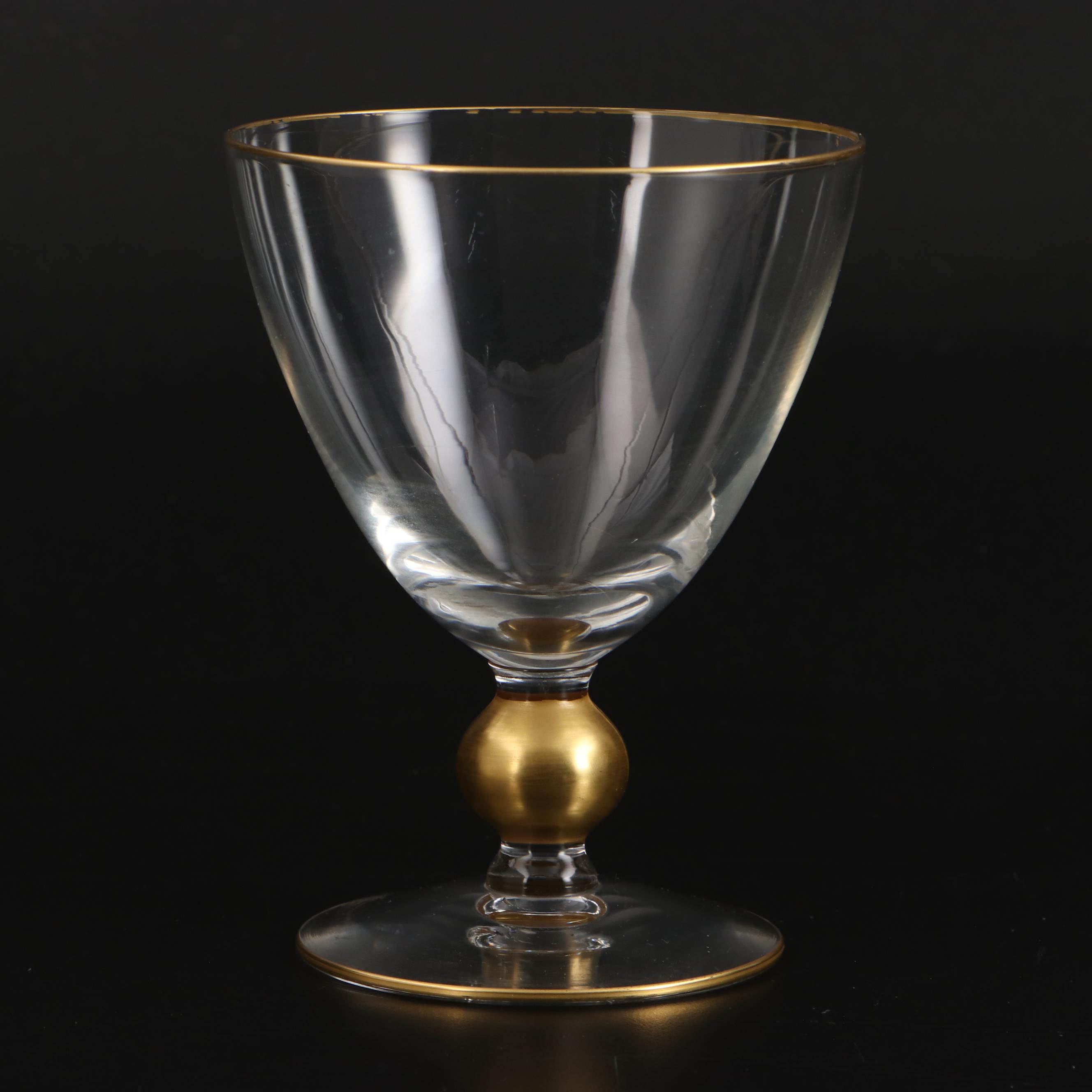 Gold Rimmed Glass Plates with Wine and Champagne Glasses