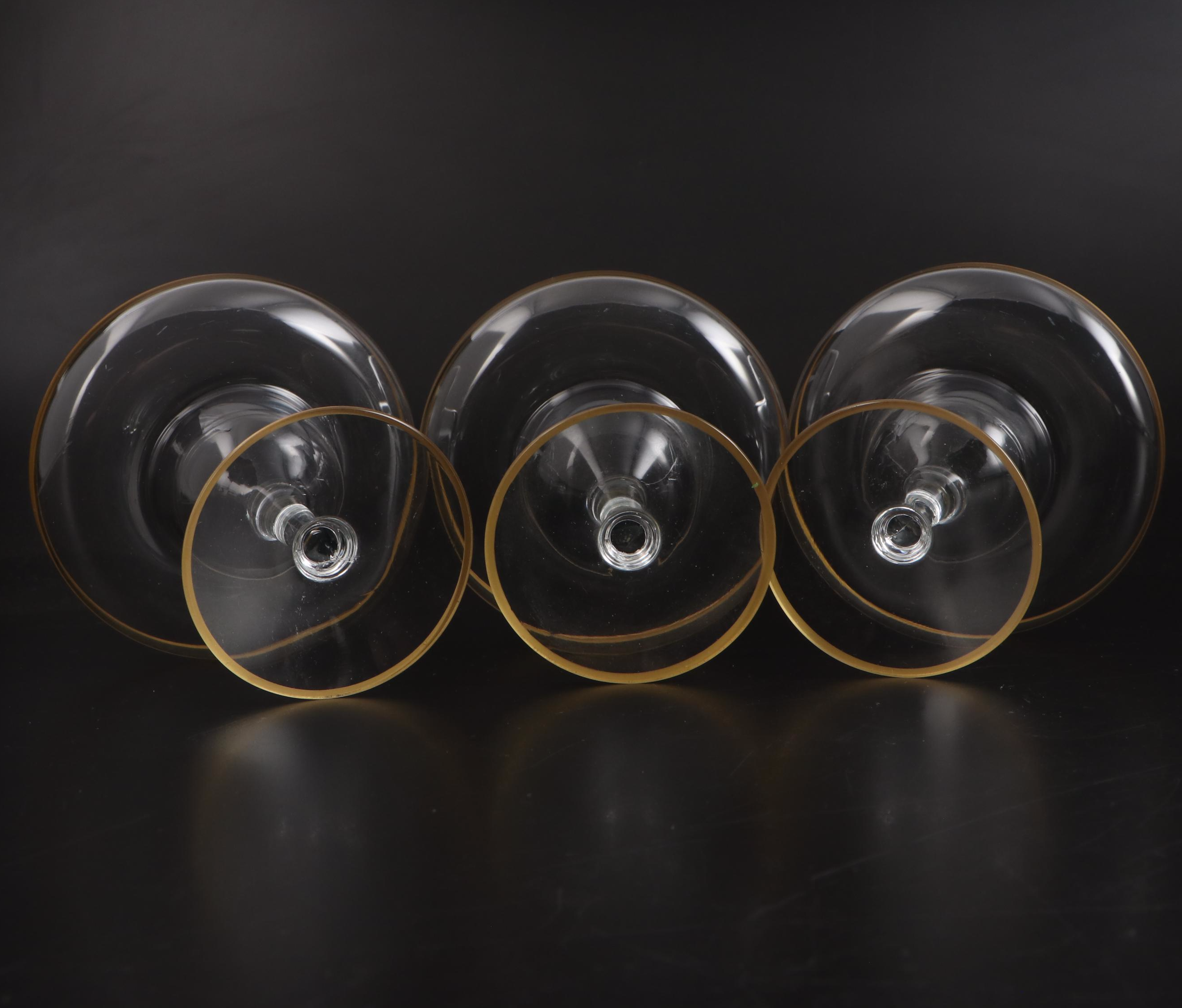 Gold Rimmed Glass Plates with Wine and Champagne Glasses