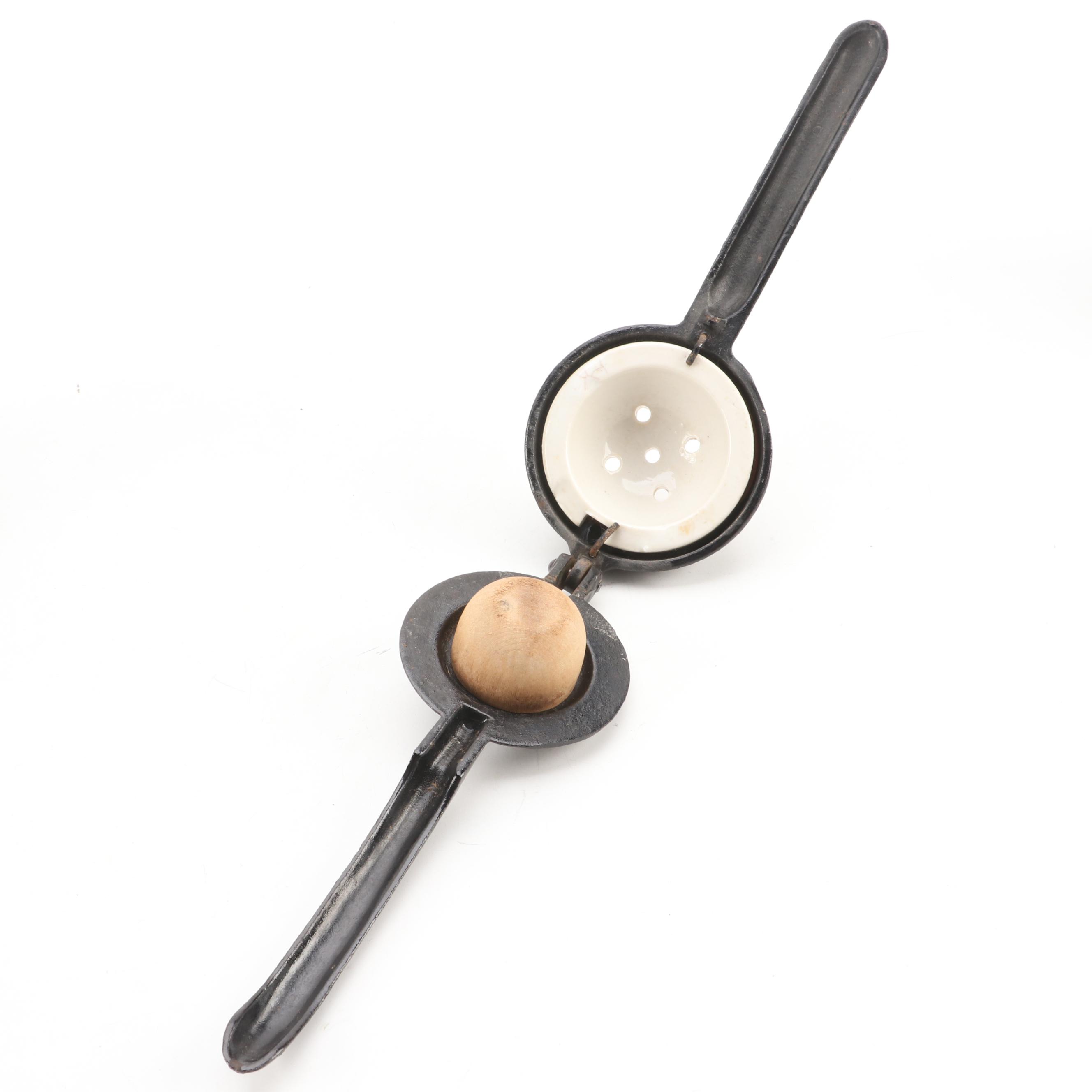 Arcade Cast Iron Lemon Squeezer with Toleware Containers and Other Kitchenware