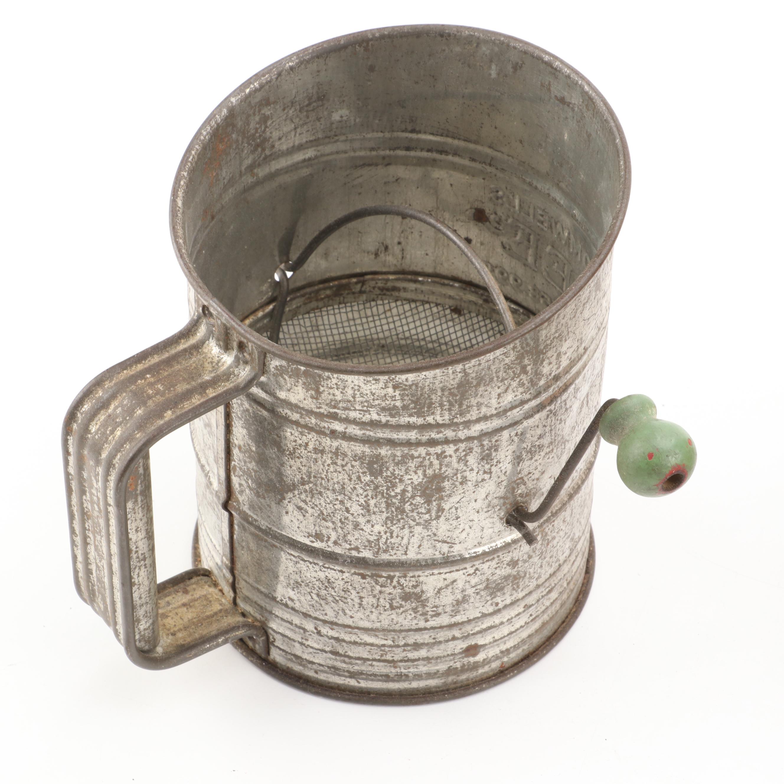 Arcade Cast Iron Lemon Squeezer with Toleware Containers and Other Kitchenware