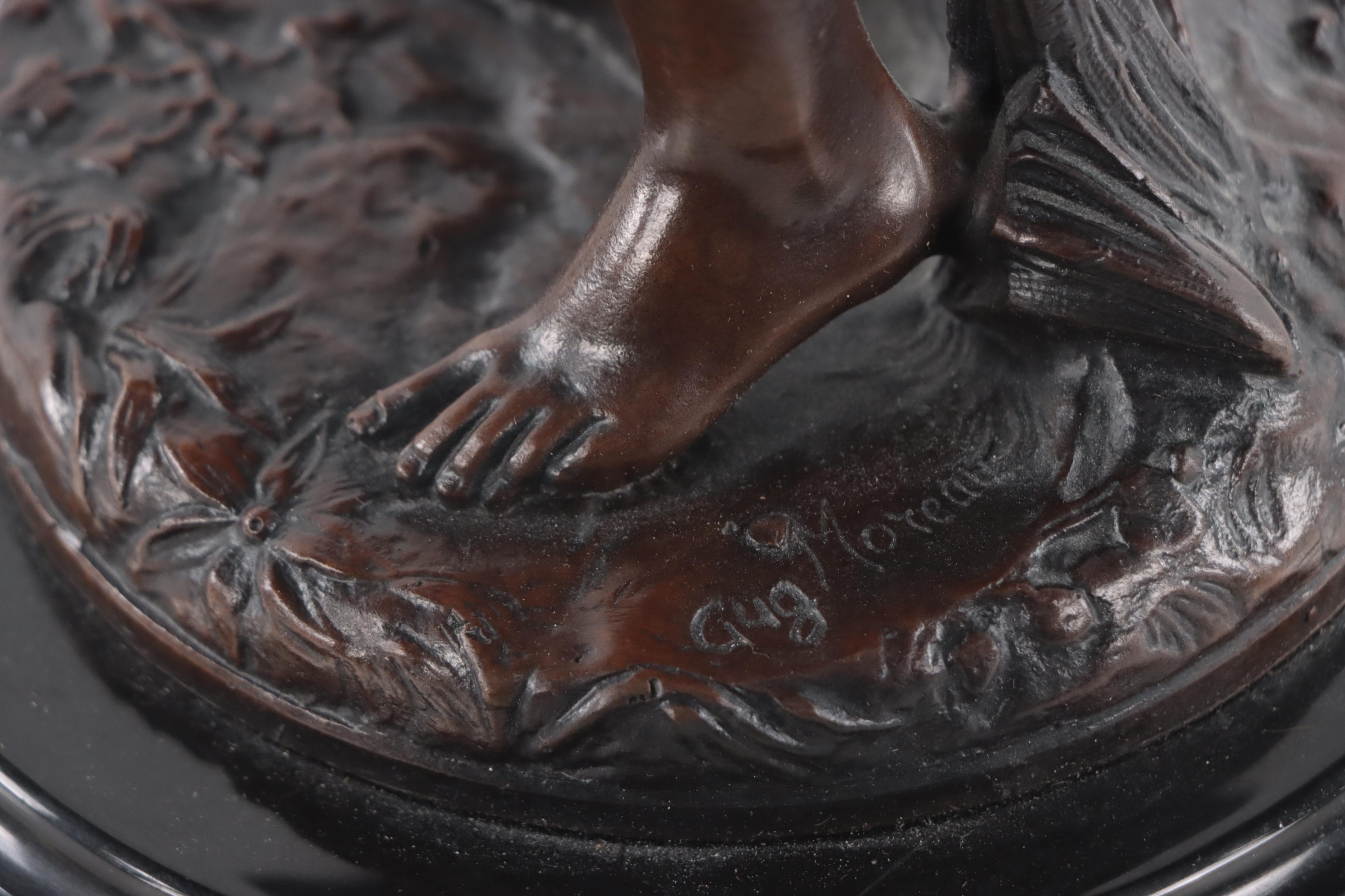 Bronze Sculpture of Woman Holding Flowers